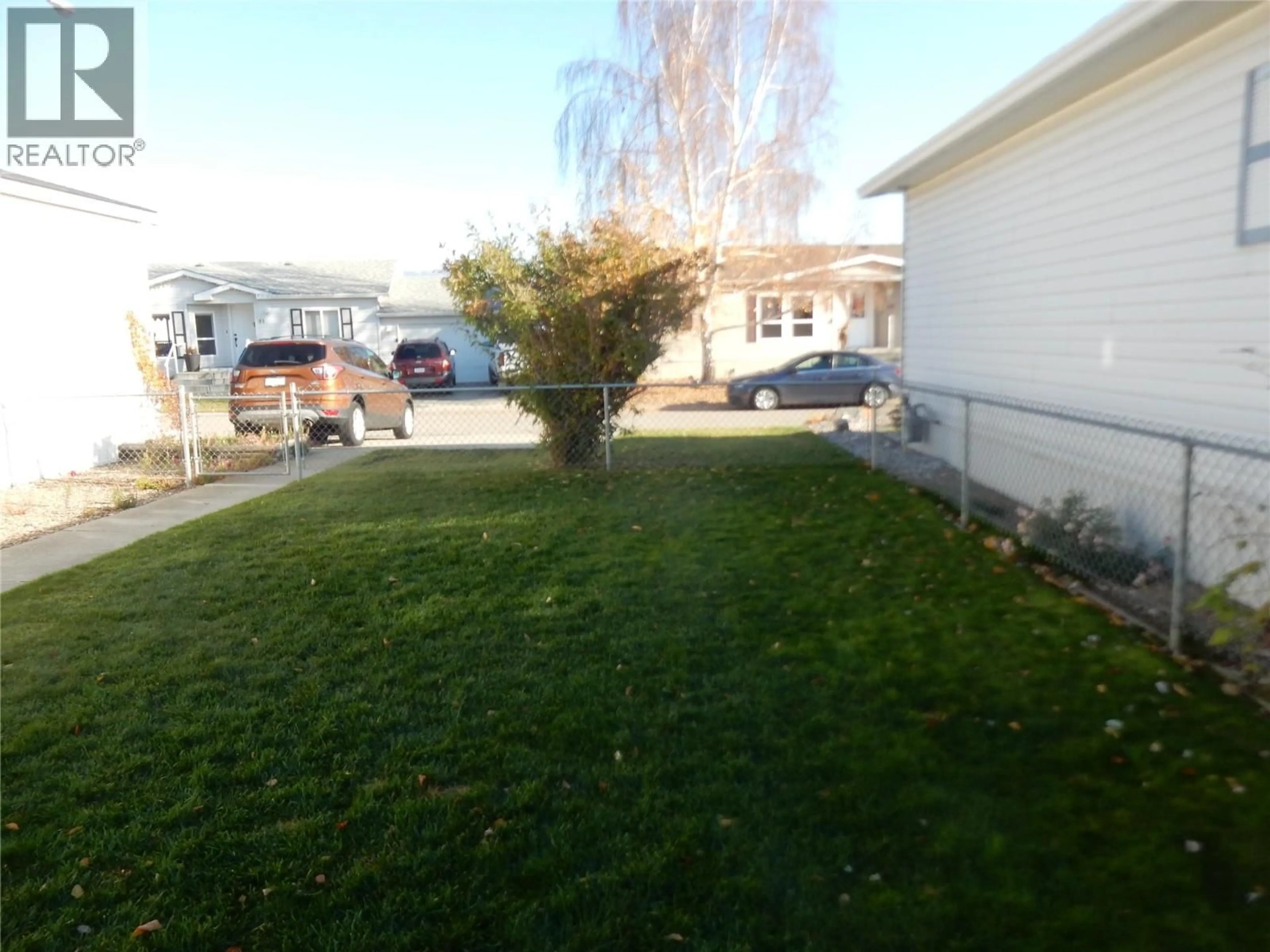 A pic from outside/outdoor area/front of a property/back of a property/a pic from drone, street for 118 - 6688 TRONSON ROAD, Vernon British Columbia V1H1R9