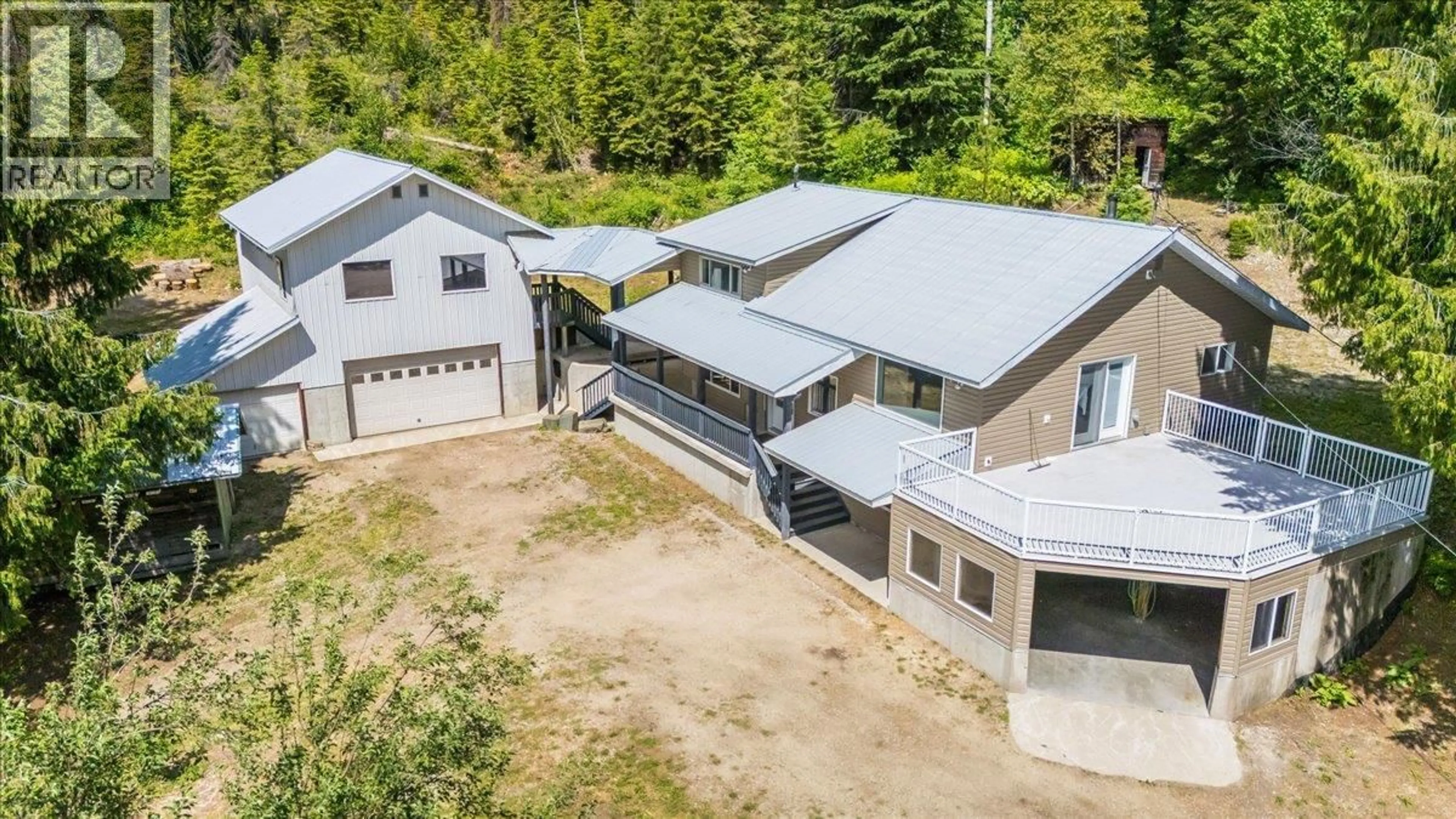 A pic from outside/outdoor area/front of a property/back of a property/a pic from drone, building for 5270 CALLBECK ROAD, Nelson British Columbia V1L6N2