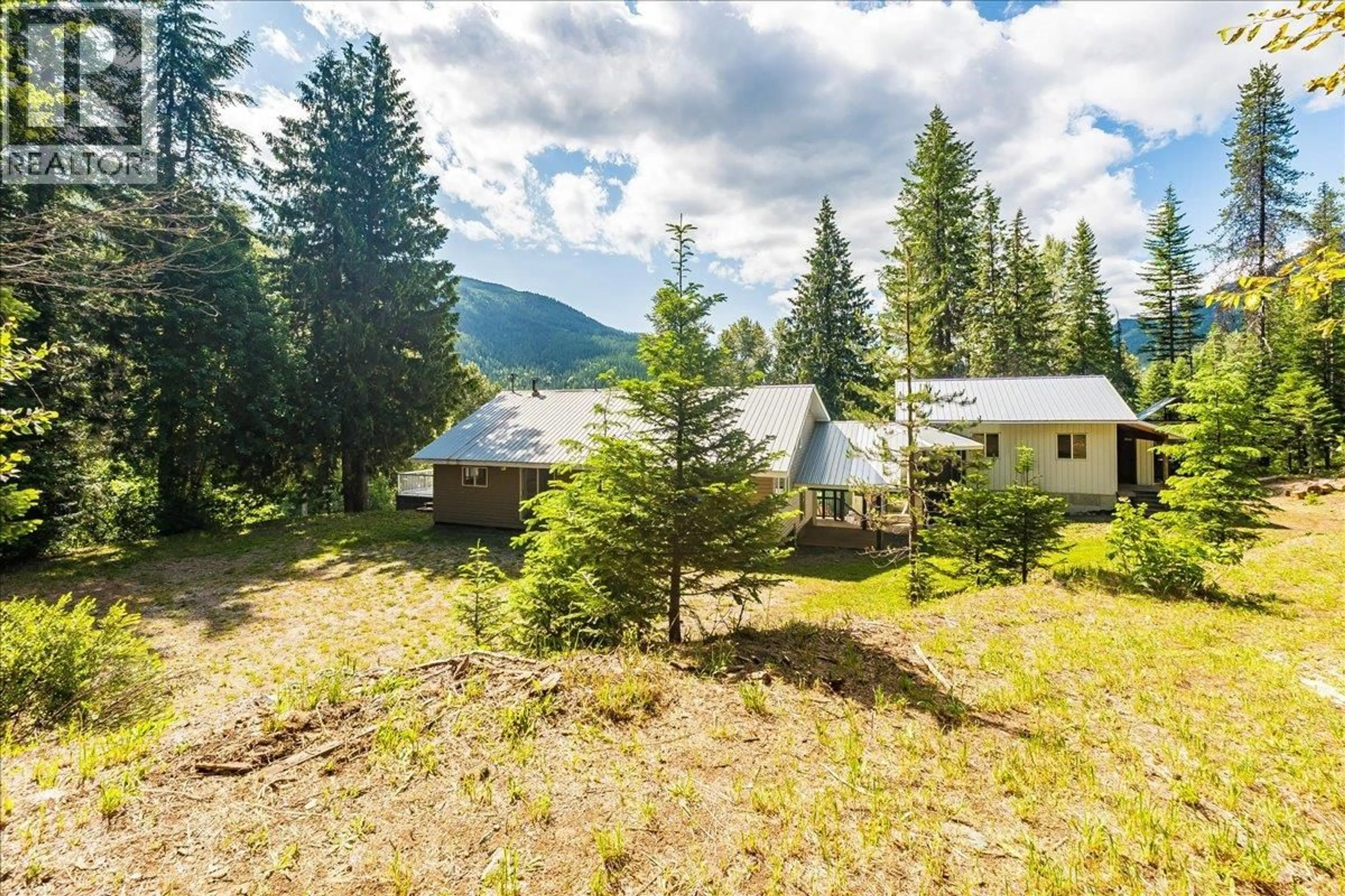 A pic from outside/outdoor area/front of a property/back of a property/a pic from drone, mountain view for 5270 CALLBECK ROAD, Nelson British Columbia V1L6N2