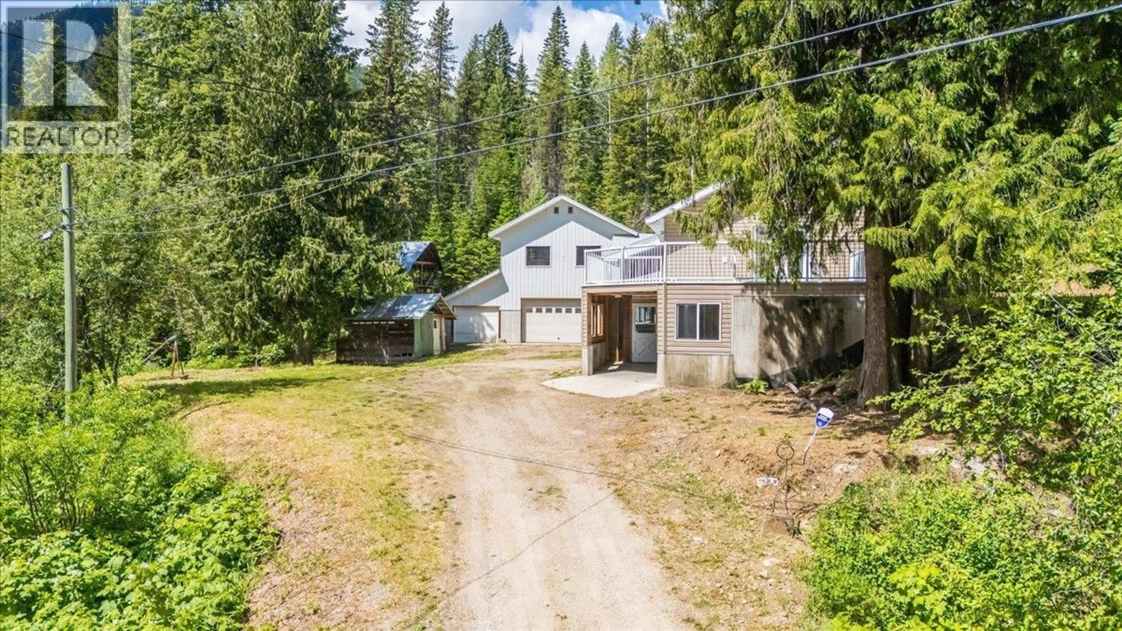 A pic from outside/outdoor area/front of a property/back of a property/a pic from drone, street for 5270 CALLBECK ROAD, Nelson British Columbia V1L6N2