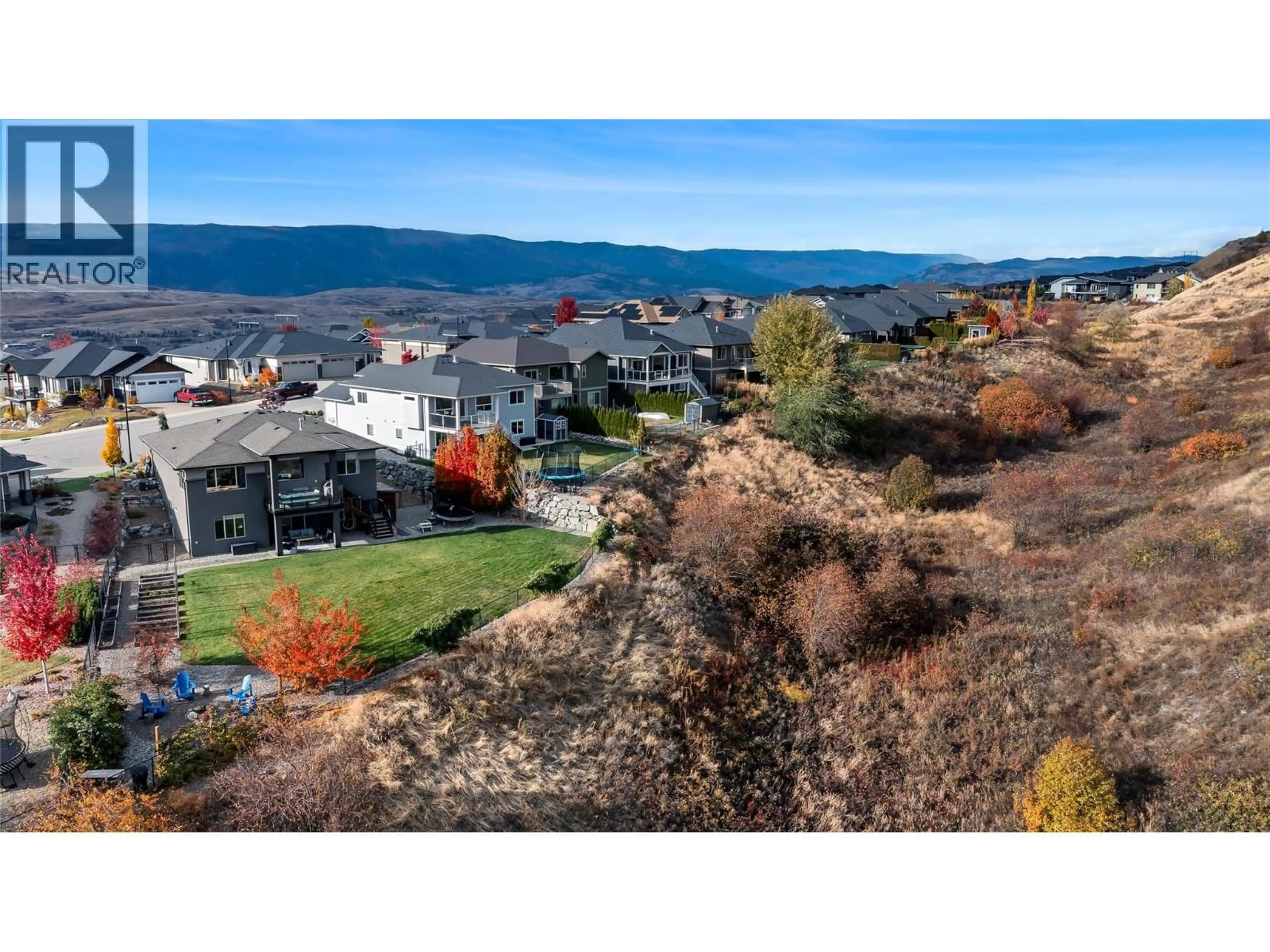 A pic from outside/outdoor area/front of a property/back of a property/a pic from drone, mountain view for 221 KICKING HORSE PLACE, Vernon British Columbia V1B4E8