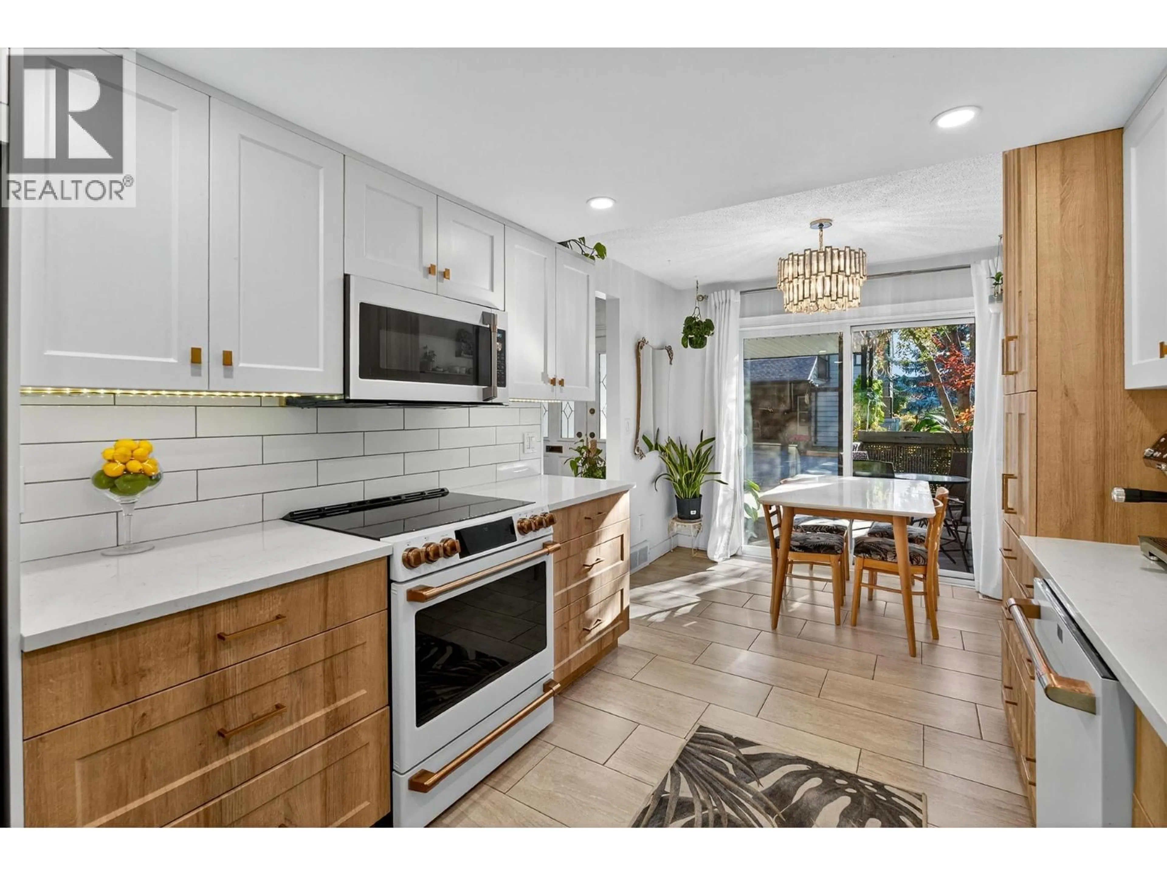 Open concept kitchen, ceramic/tile floor for 107 - 1050 SPRINGFIELD ROAD, Kelowna British Columbia V1Y8J7