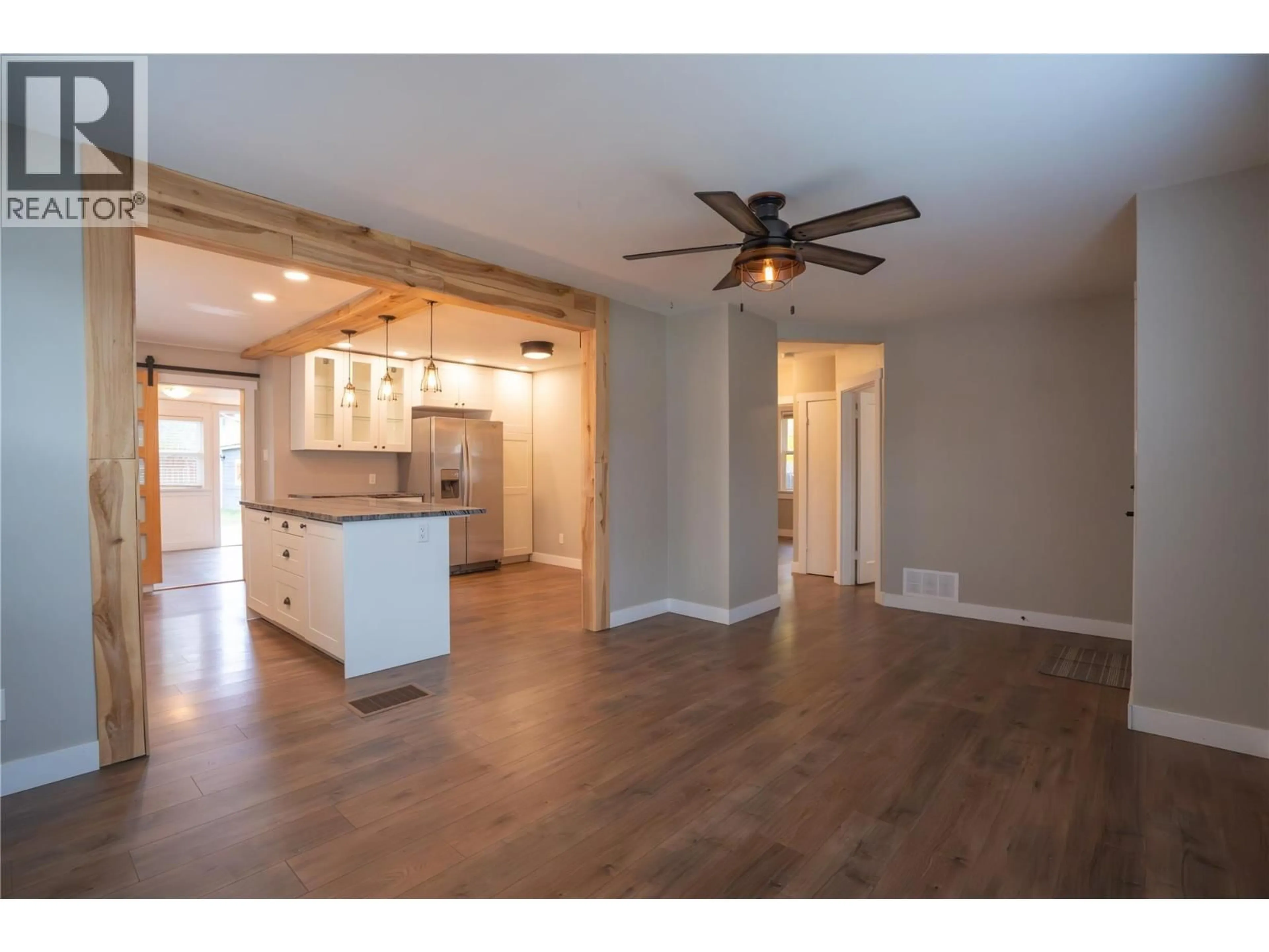 Open concept kitchen, wood/laminate floor for 1009 KILLARNEY STREET, Penticton British Columbia V2A4P6