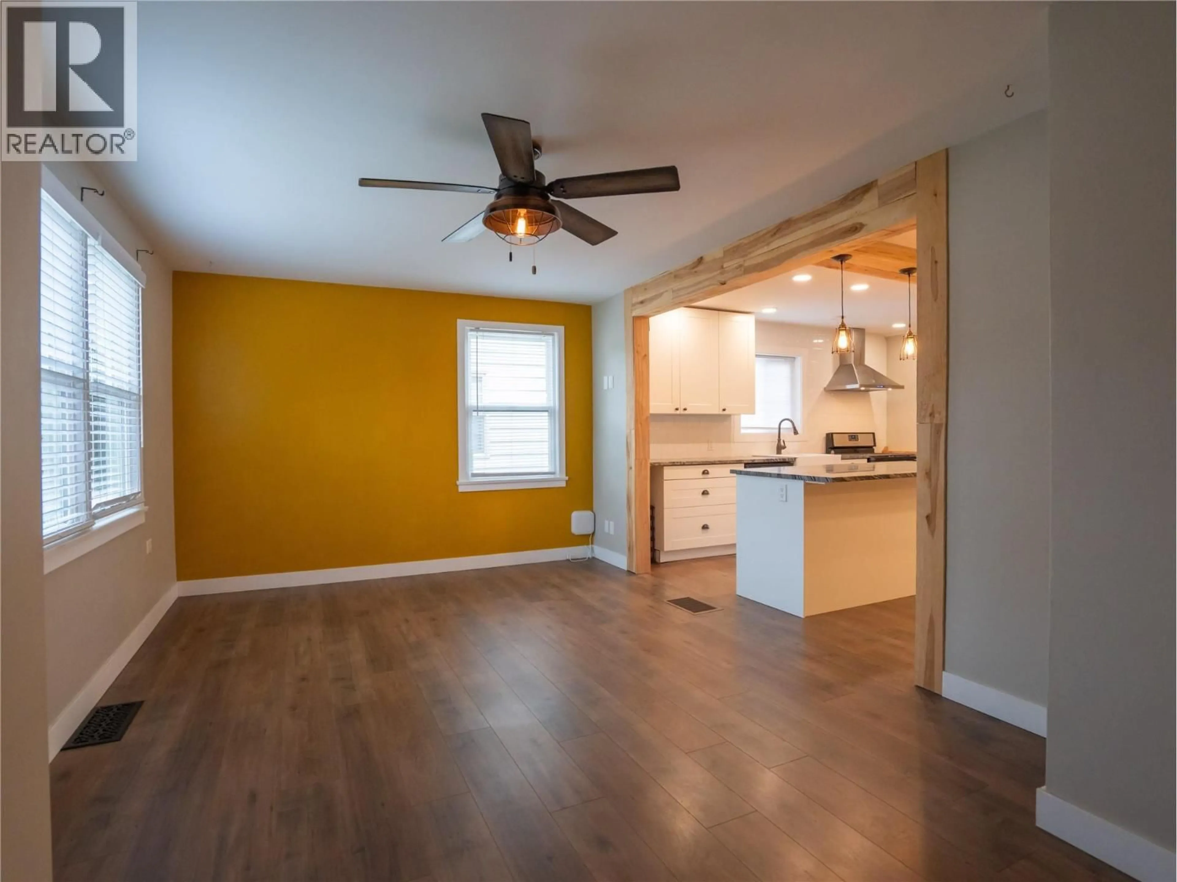 Open concept kitchen, wood/laminate floor for 1009 KILLARNEY STREET, Penticton British Columbia V2A4P6