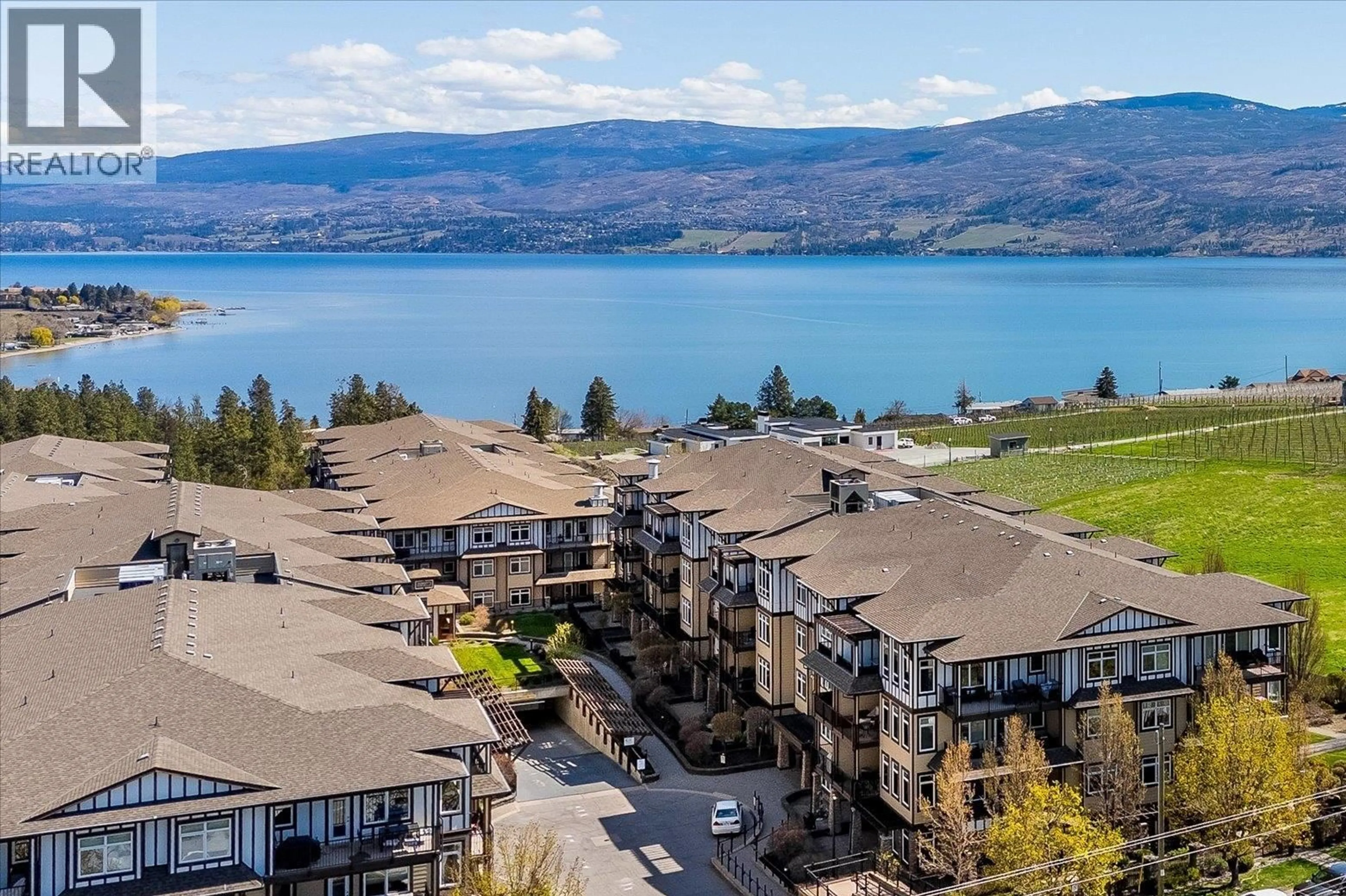 A pic from outside/outdoor area/front of a property/back of a property/a pic from drone, water/lake/river/ocean view for 2110 - 3843 BROWN ROAD, West Kelowna British Columbia V4T2J3