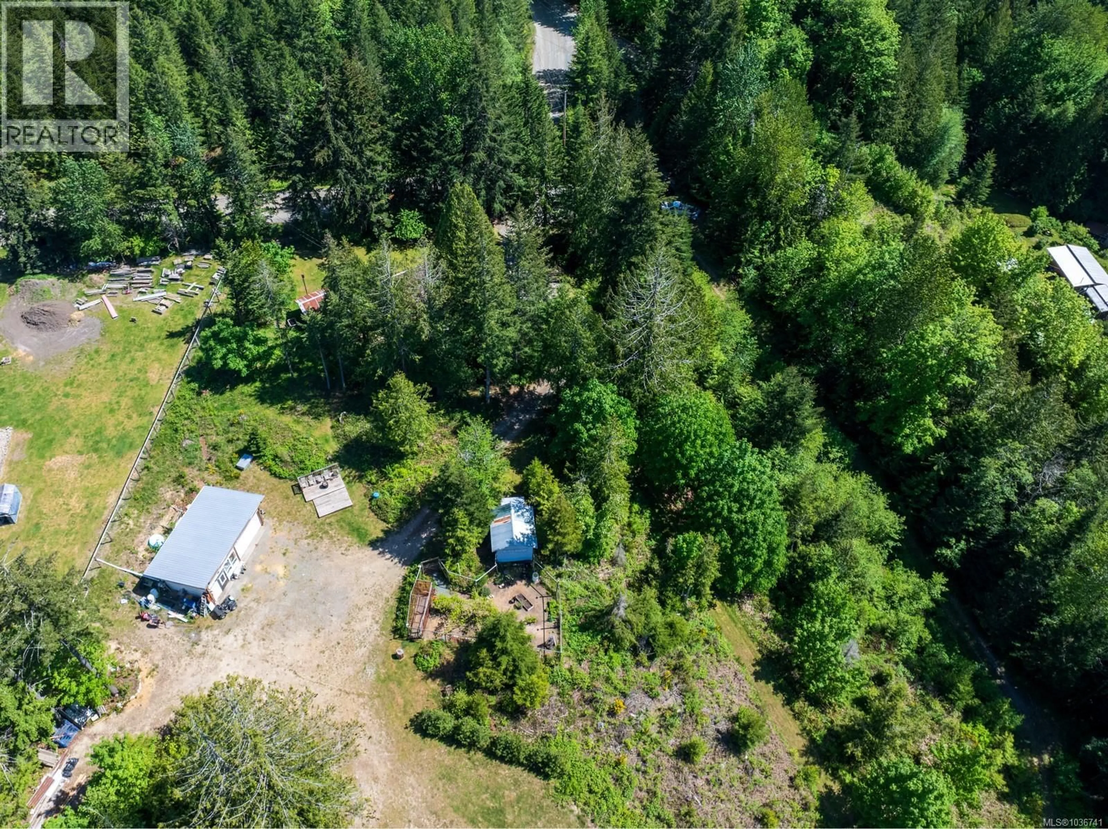 A pic from outside/outdoor area/front of a property/back of a property/a pic from drone, forest/trees view for 5950 HEGER ROAD, Lake Cowichan British Columbia V0R2G0