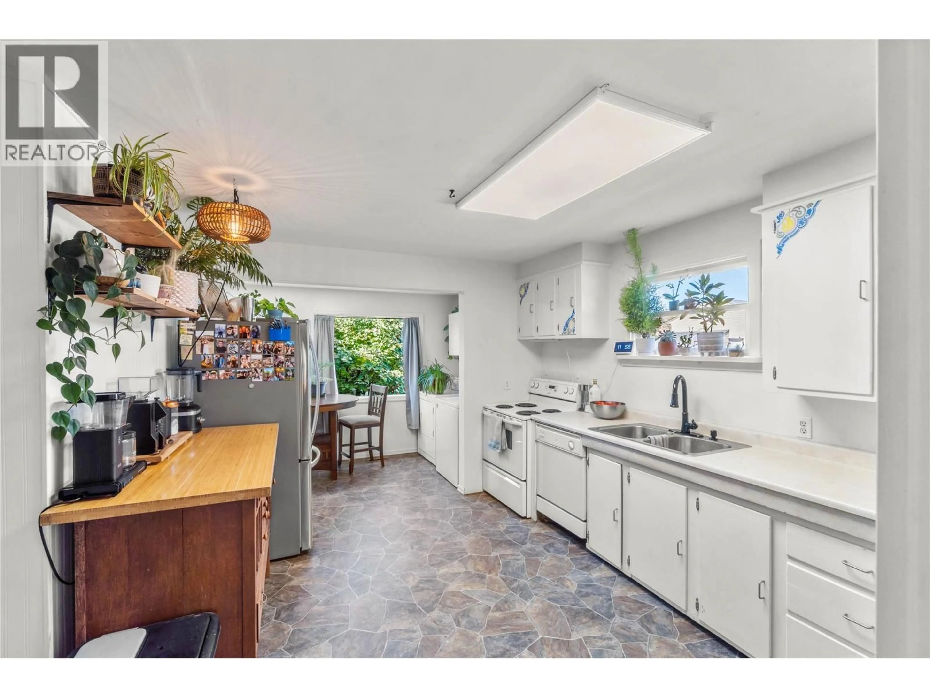 Open concept kitchen, ceramic/tile floor for 734 SINGH STREET, Kamloops British Columbia V2B5C5