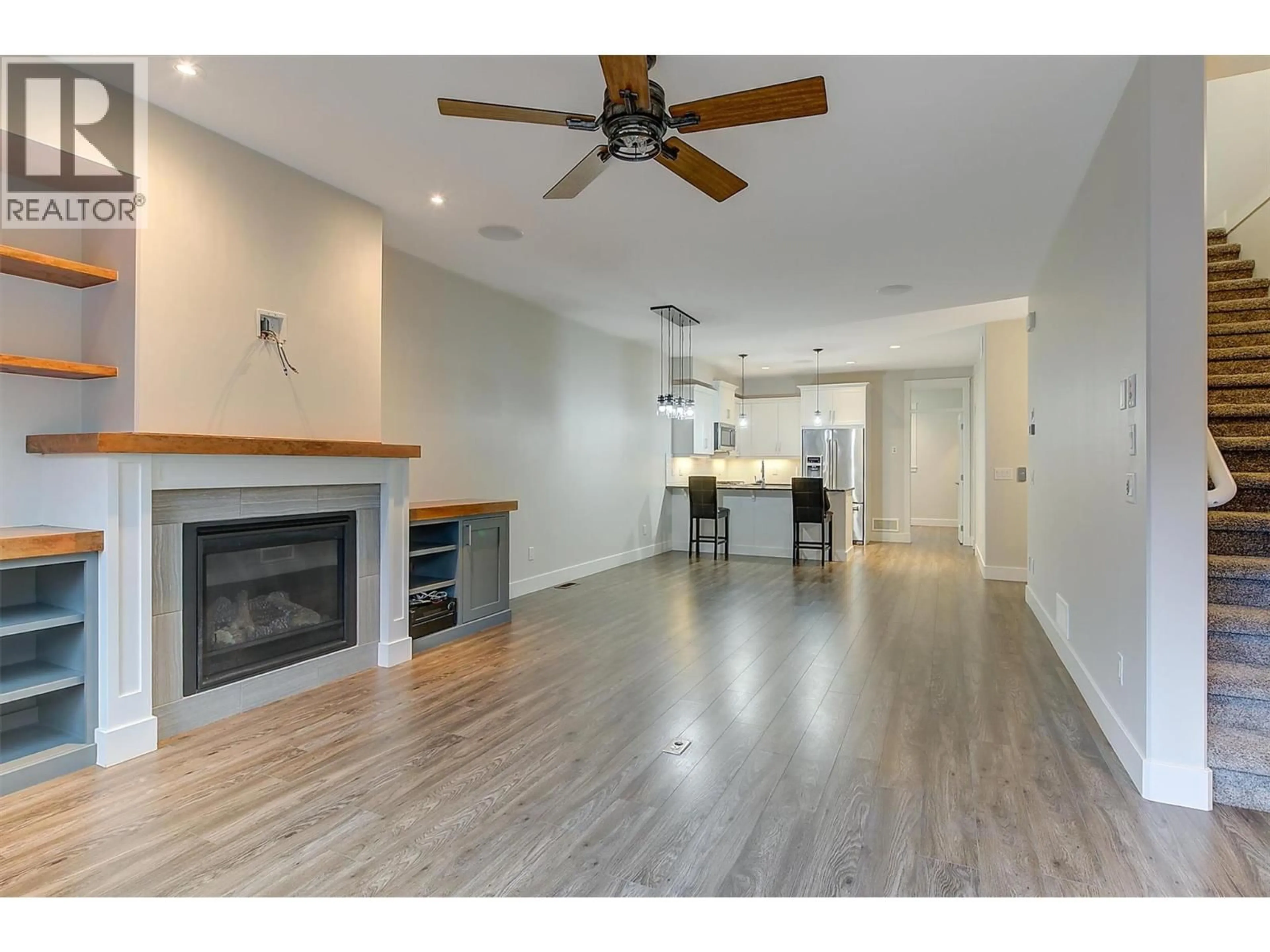 Open concept kitchen, wood/laminate floor for 42 - 3359 COUGAR ROAD, West Kelowna British Columbia V4T3G1