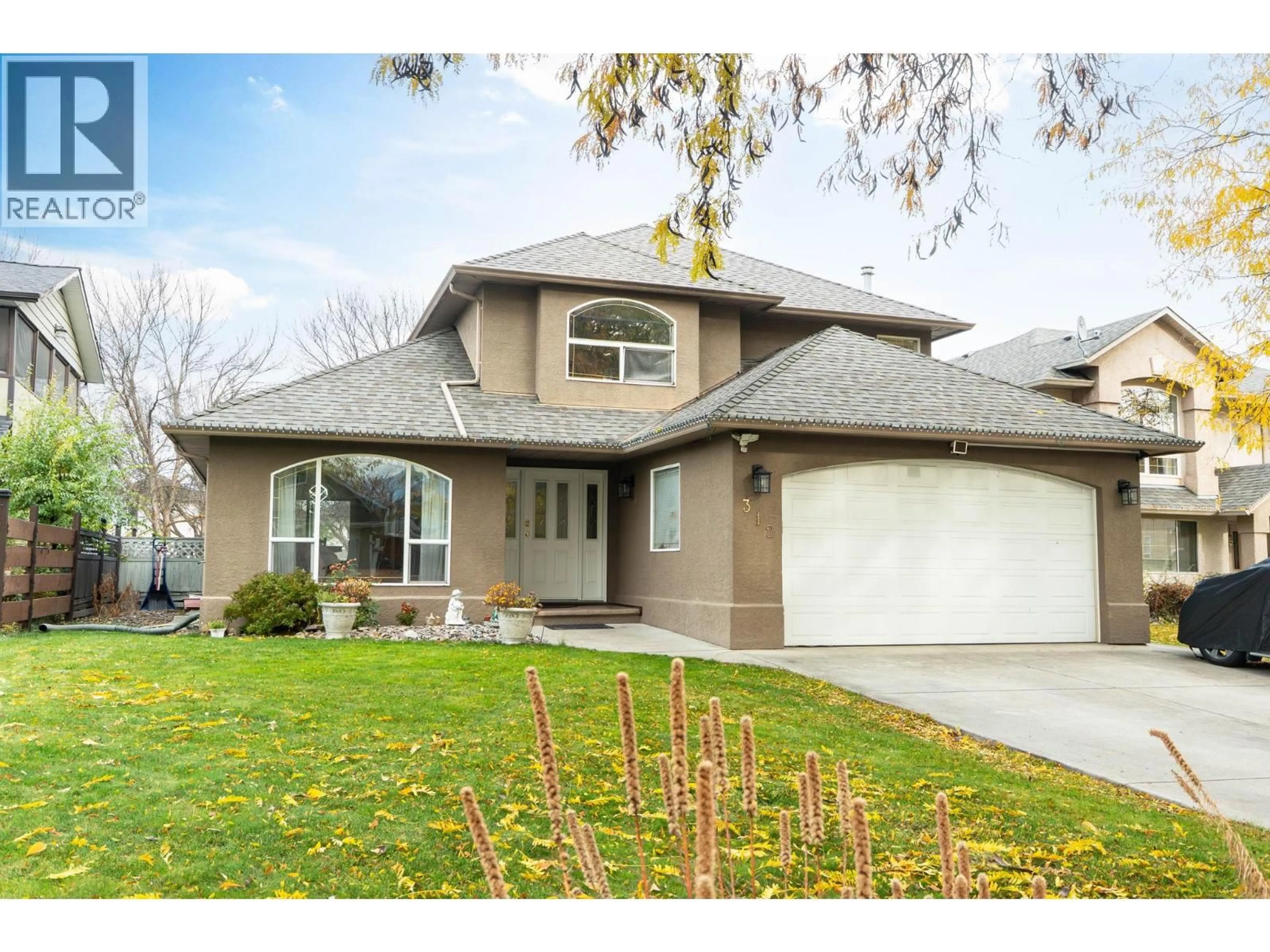 Home with vinyl exterior material, street for 312 FIZET AVENUE, Kelowna British Columbia V1X7P5