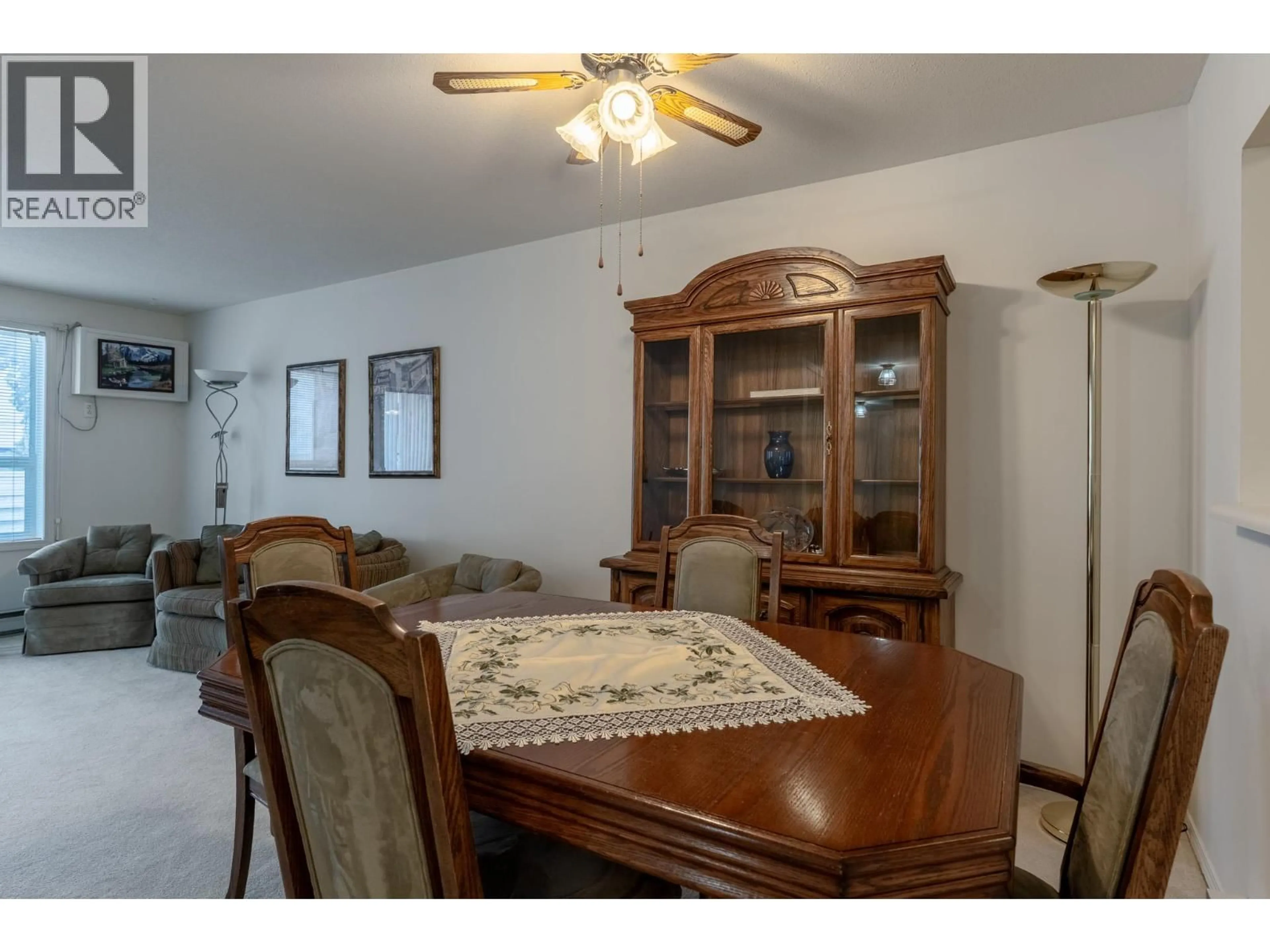 Dining room, wood/laminate floor for 208 - 1329 KLO ROAD, Kelowna British Columbia V1W3N9