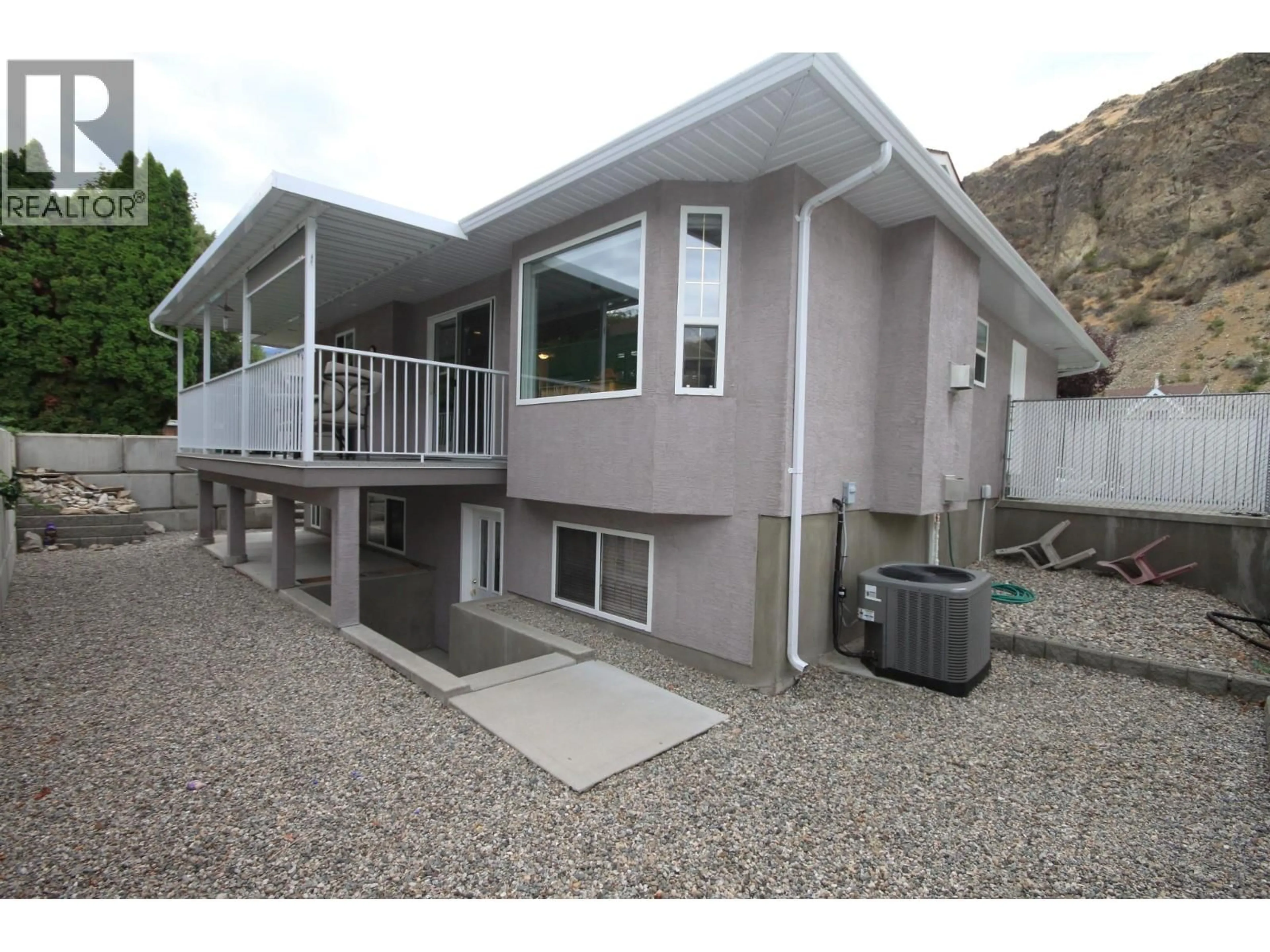 Home with vinyl exterior material, mountain view for 957 MORNINGSTAR ROAD, Oliver British Columbia V0H1T6