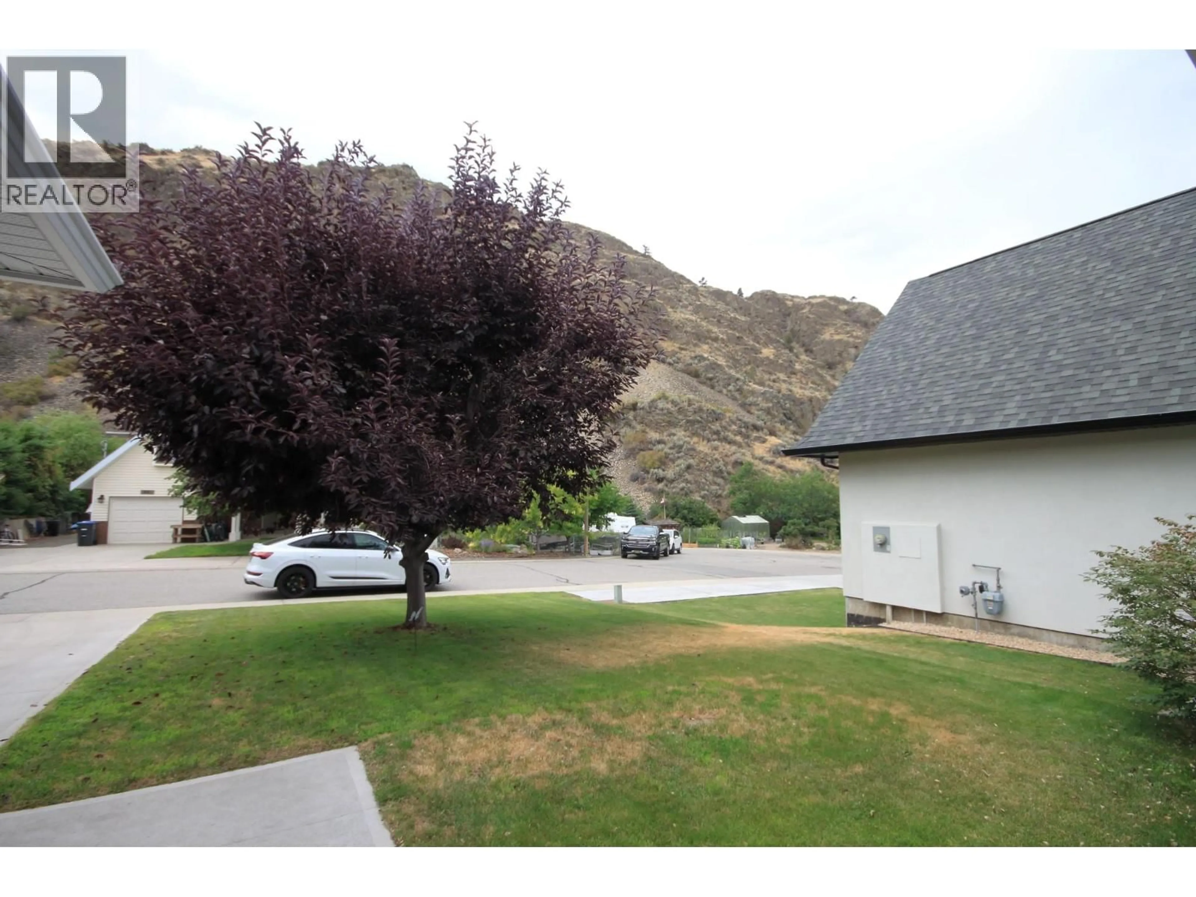 A pic from outside/outdoor area/front of a property/back of a property/a pic from drone, mountain view for 957 MORNINGSTAR ROAD, Oliver British Columbia V0H1T6