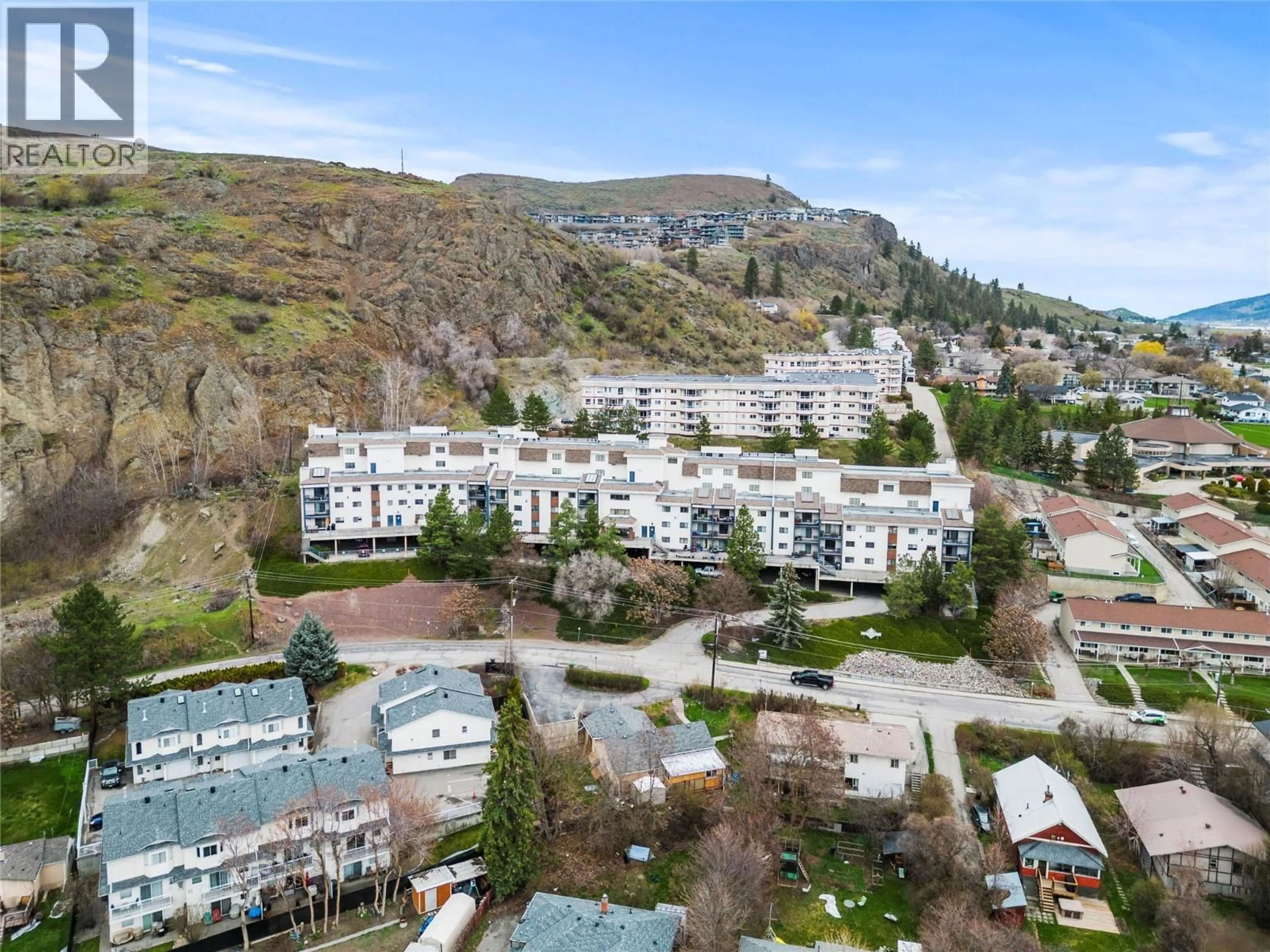 A pic from outside/outdoor area/front of a property/back of a property/a pic from drone, mountain view for 210 - 3901 32 AVENUE, Vernon British Columbia V1T8M3
