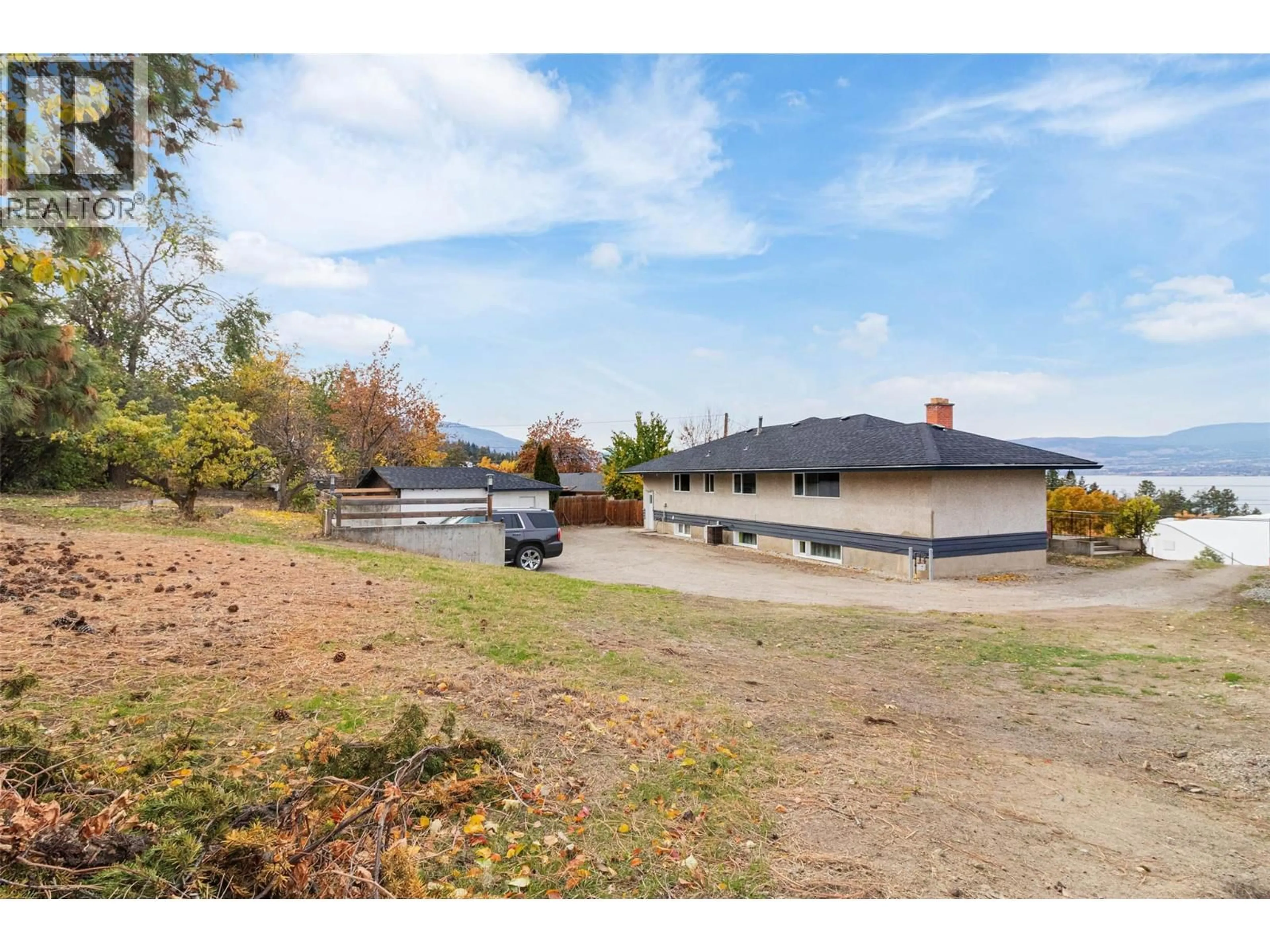 A pic from outside/outdoor area/front of a property/back of a property/a pic from drone, water/lake/river/ocean view for 4829 LAKESHORE ROAD, Kelowna British Columbia V1W4H6