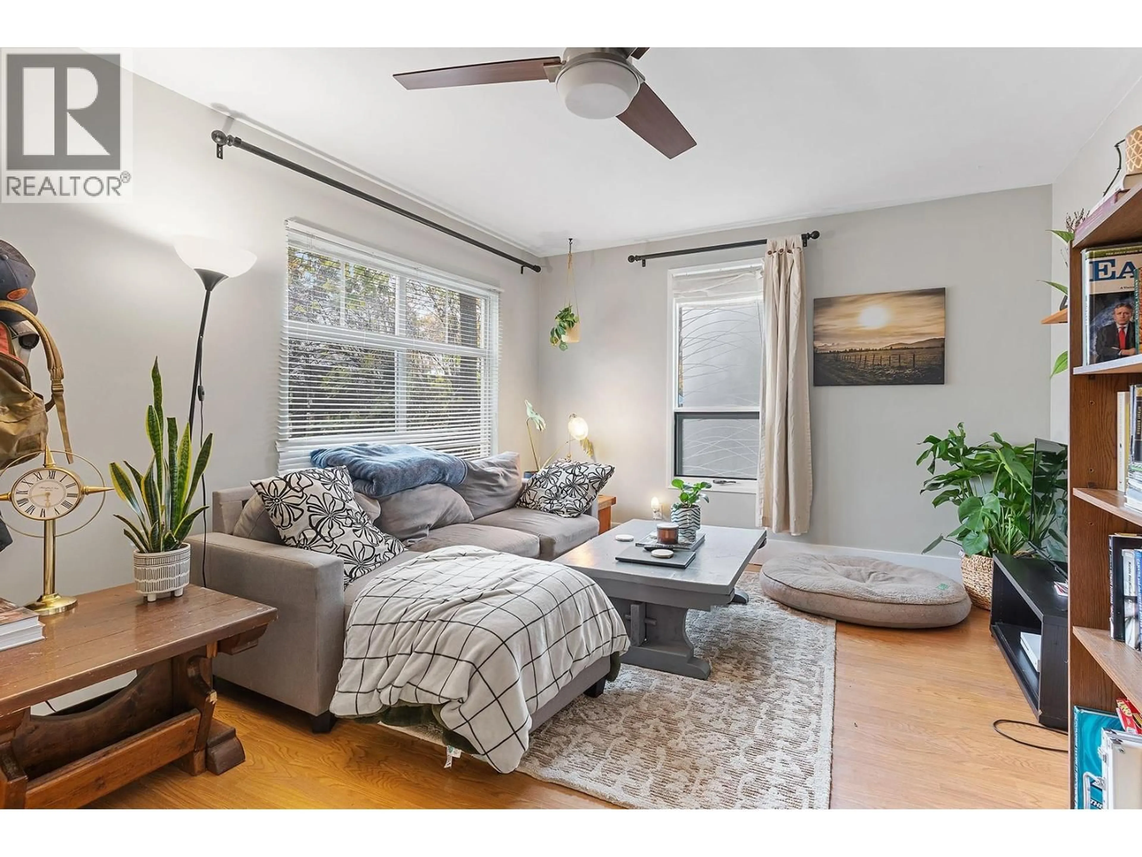 Living room with furniture, wood/laminate floor for 2108 33 STREET, Vernon British Columbia V1T5R8