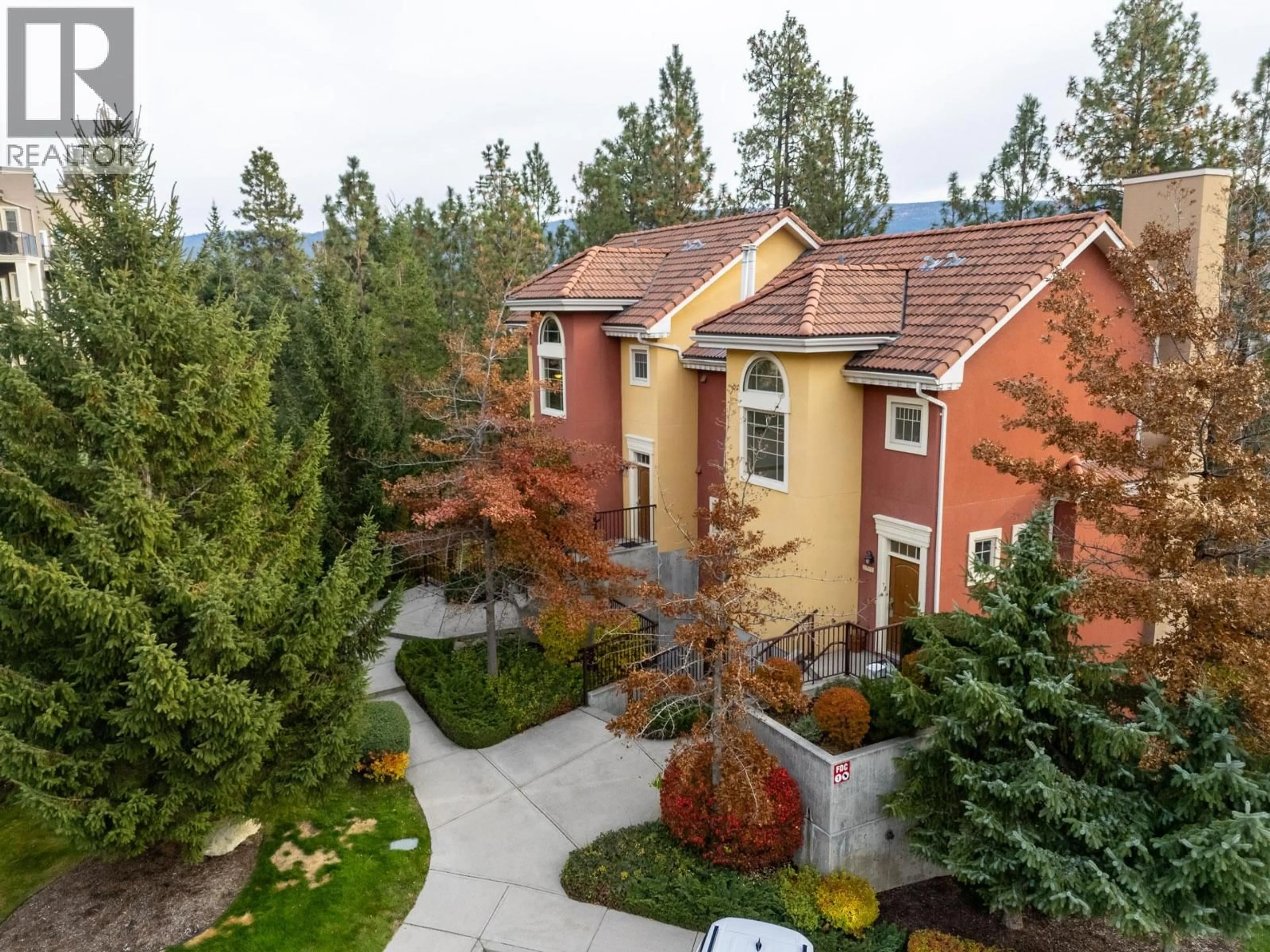 A pic from outside/outdoor area/front of a property/back of a property/a pic from drone, mountain view for 201 - 1795 COUNTRY CLUB DRIVE, Kelowna British Columbia V1V3E8