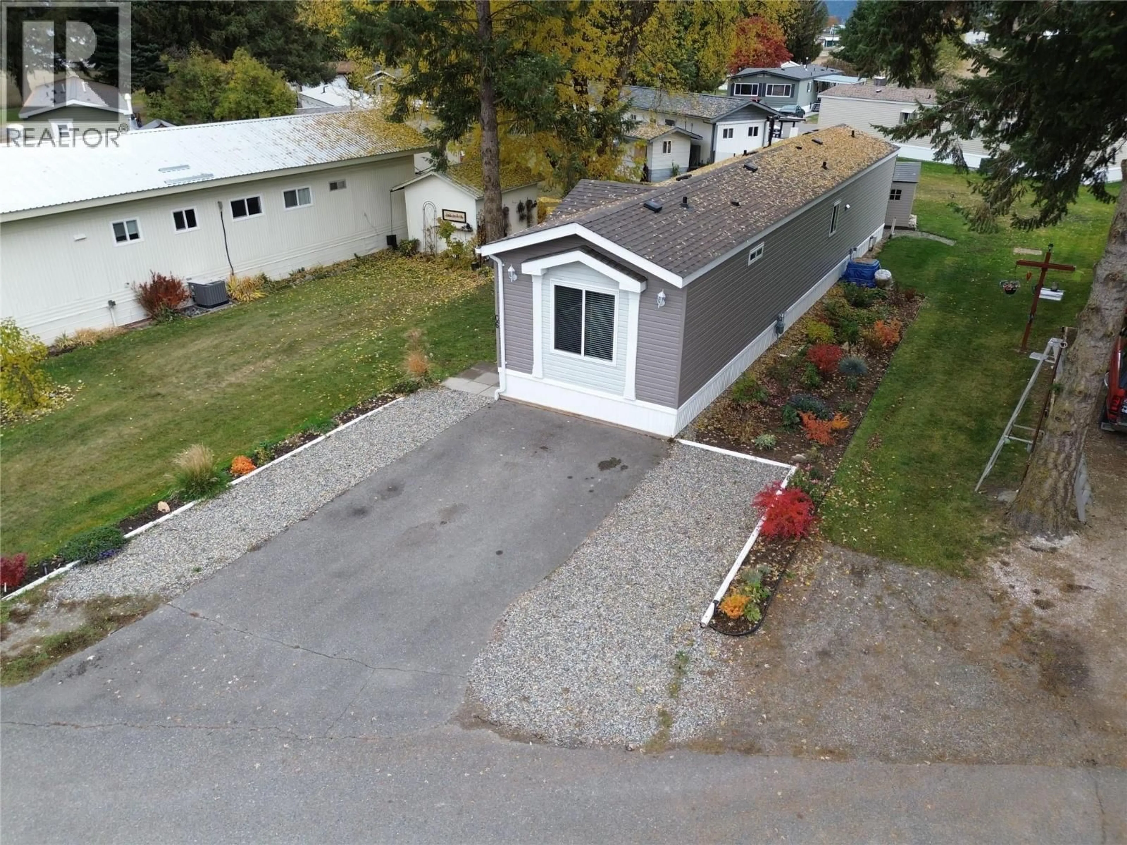 A pic from outside/outdoor area/front of a property/back of a property/a pic from drone, street for C6 - 5455 ALMOND GARDENS ROAD, Grand Forks British Columbia V0H1H4