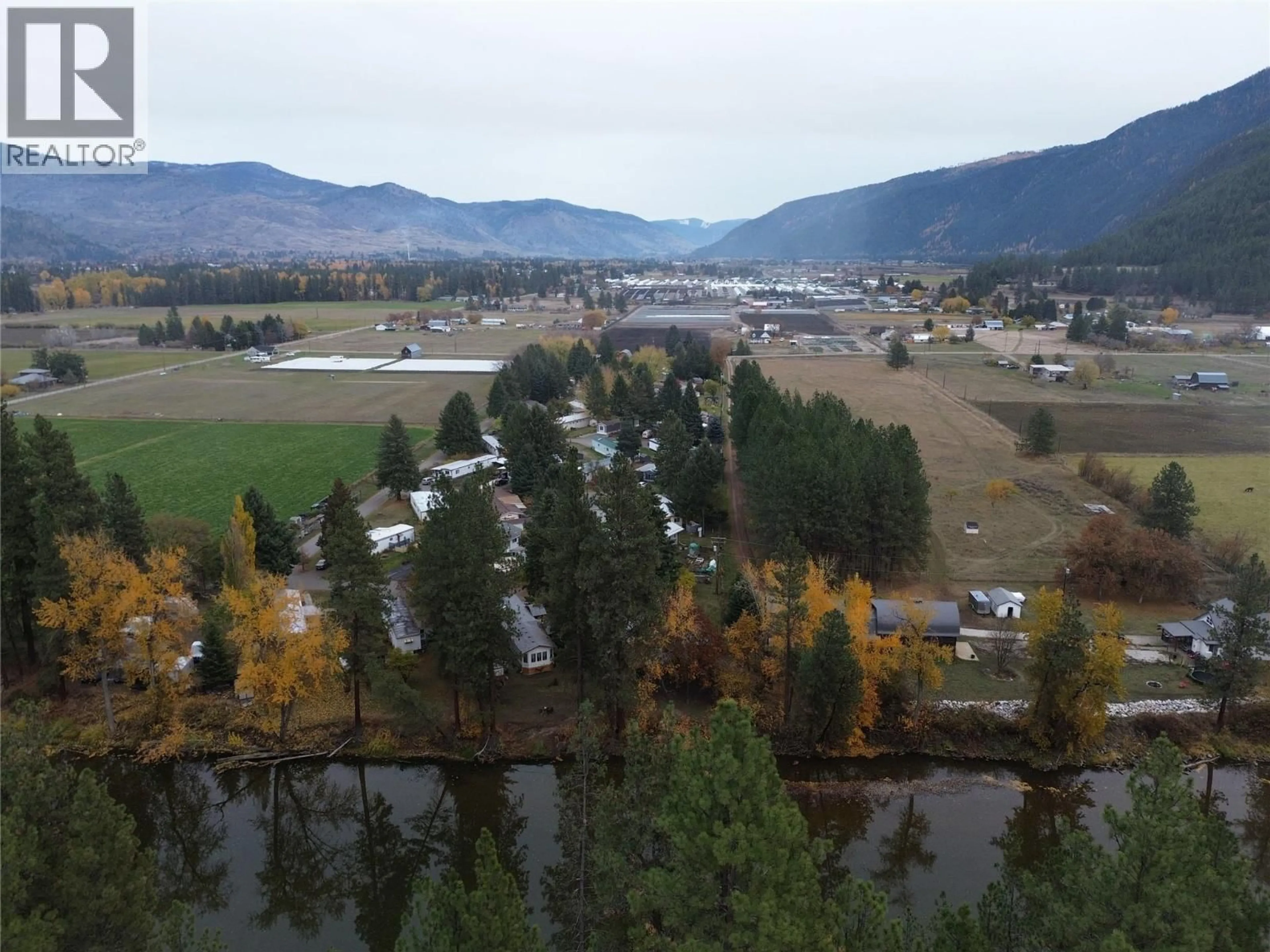 A pic from outside/outdoor area/front of a property/back of a property/a pic from drone, water/lake/river/ocean view for C6 - 5455 ALMOND GARDENS ROAD, Grand Forks British Columbia V0H1H4