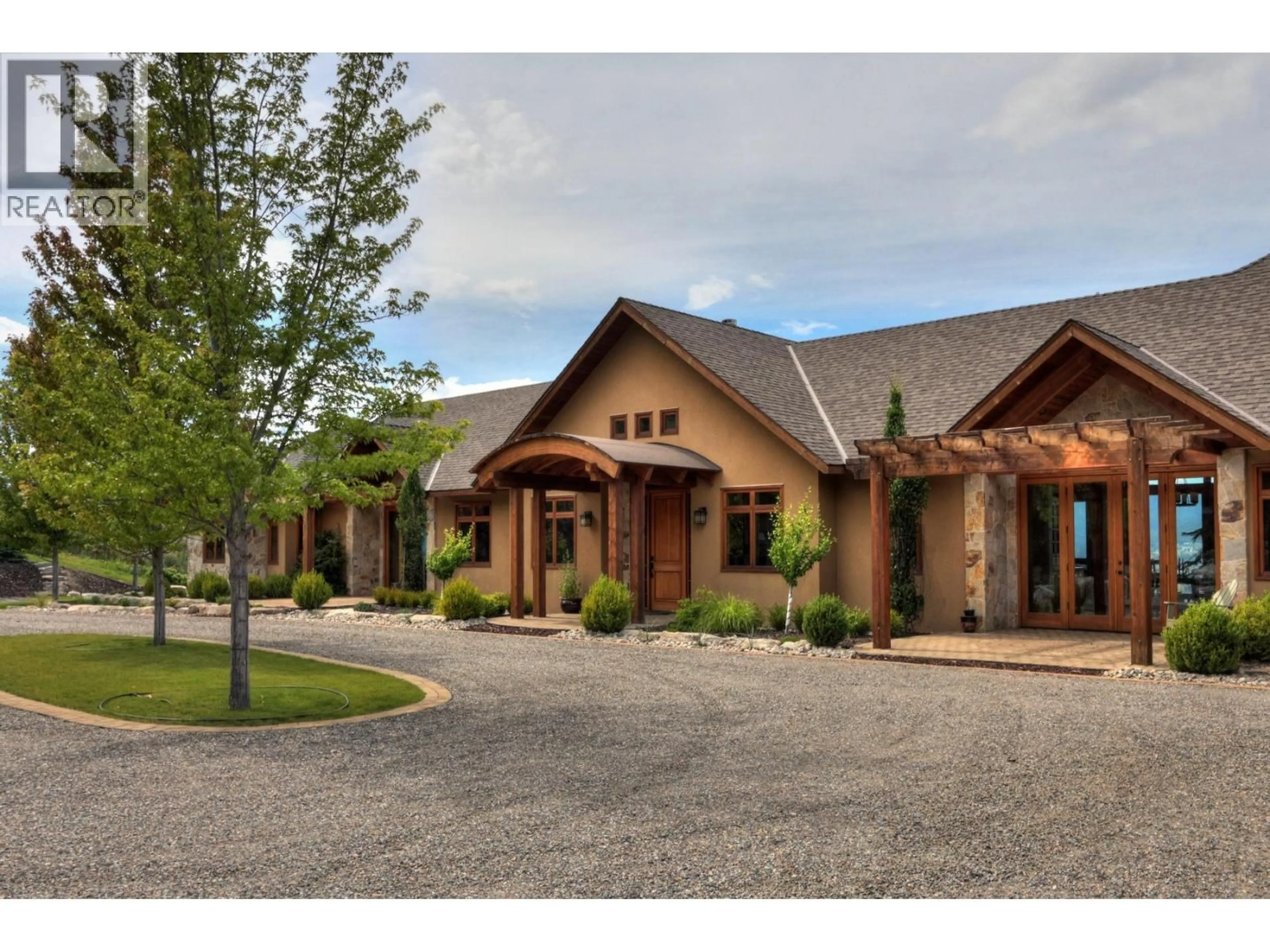 Home with brick exterior material, mountain view for 105 TIMBERLINE ROAD, Kelowna British Columbia V1W4J6