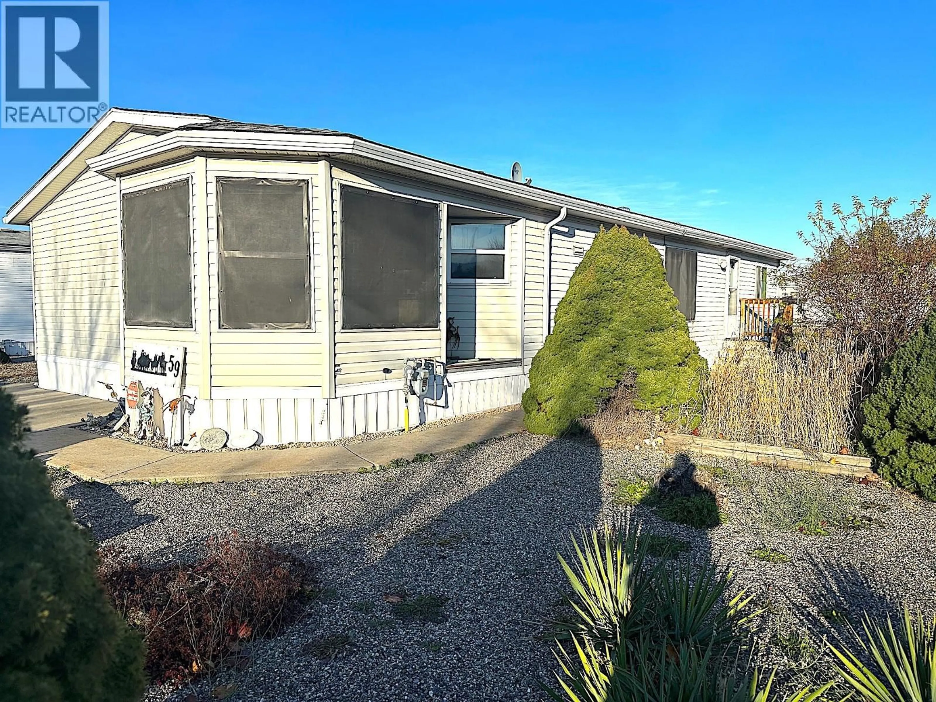 Home with vinyl exterior material, street for 59 - 9510 HIGHWAY 97N OTHER, Vernon British Columbia V1H1R8