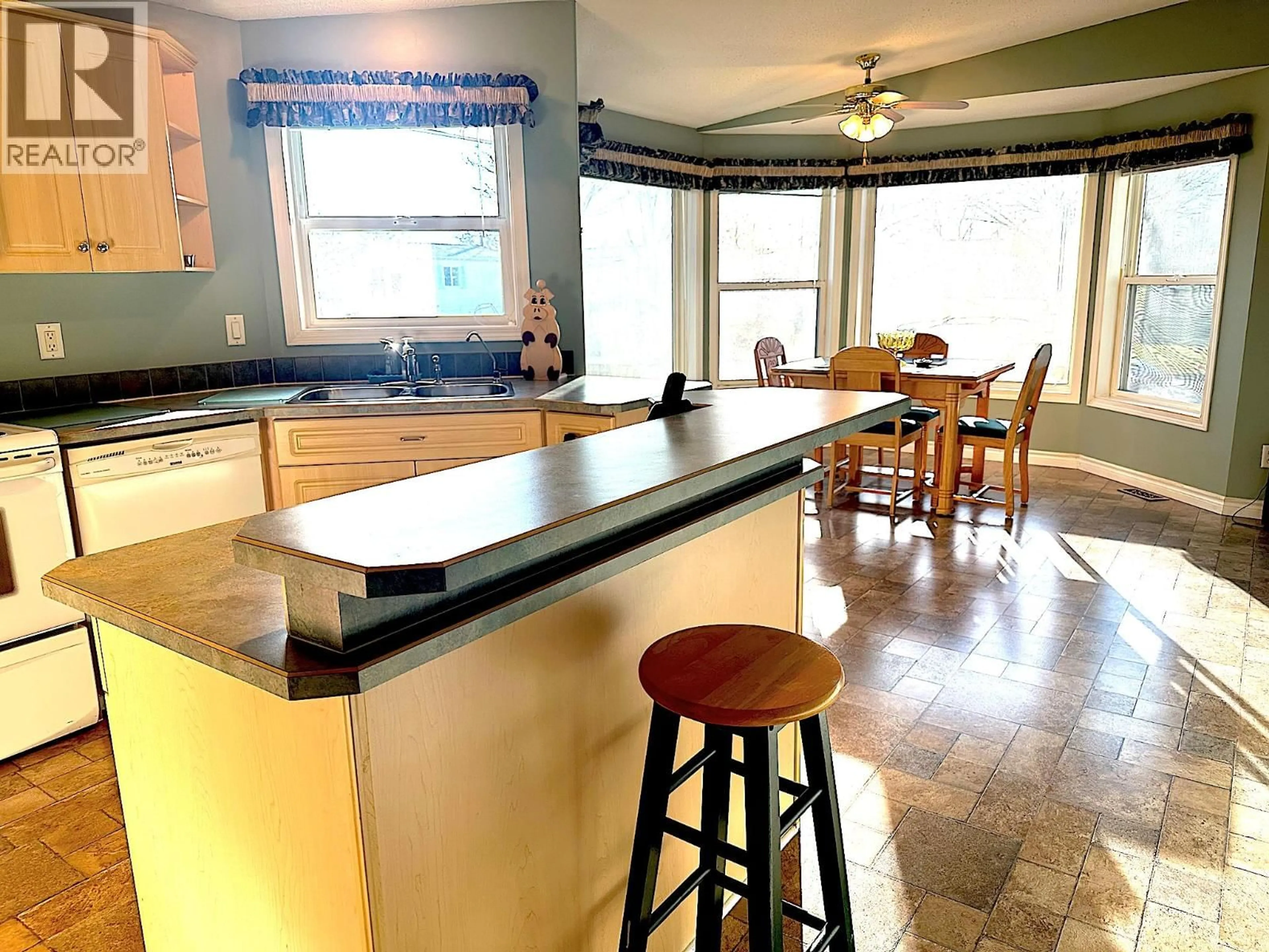 Open concept kitchen, ceramic/tile floor for 59 - 9510 HIGHWAY 97N OTHER, Vernon British Columbia V1H1R8