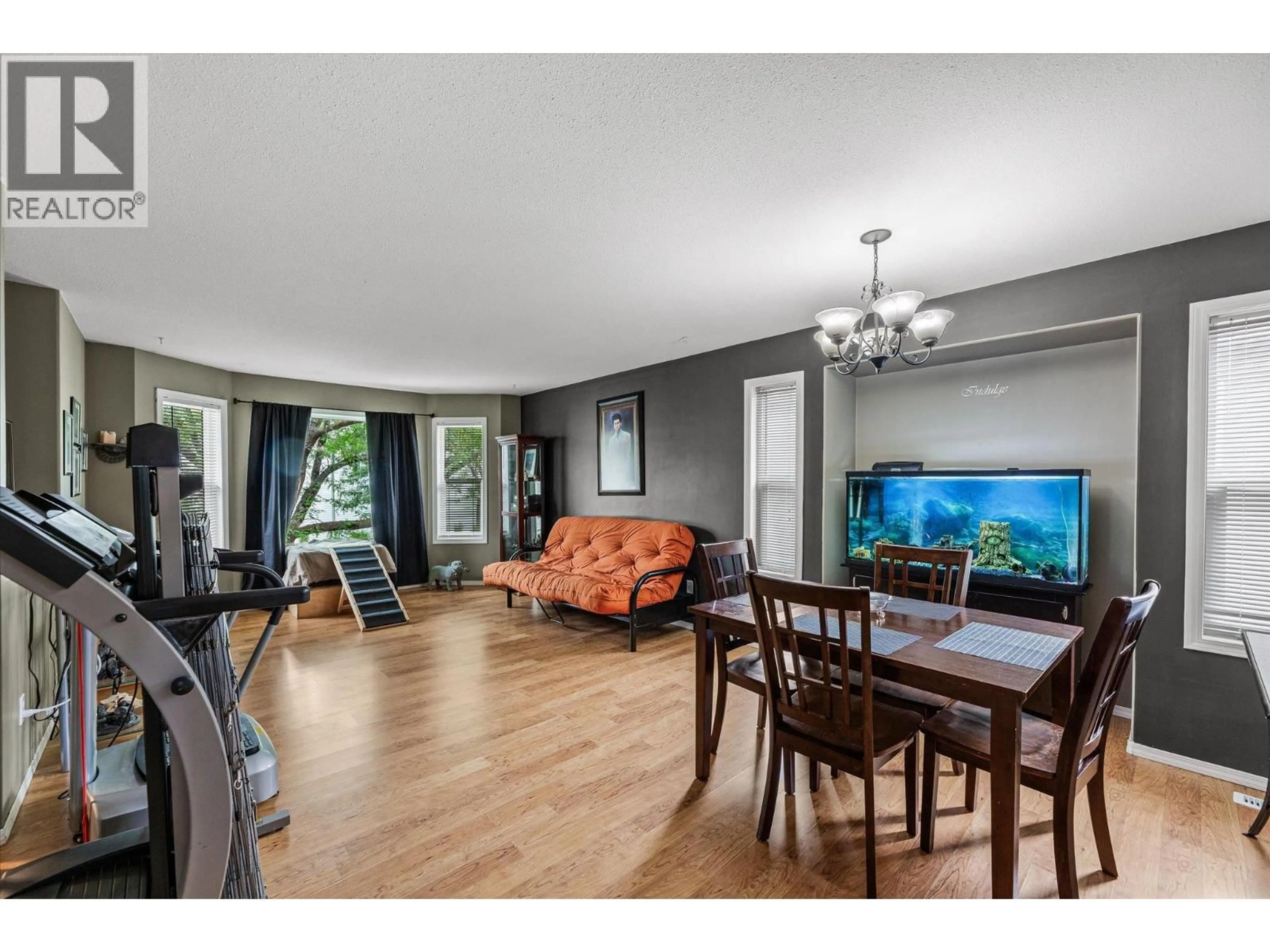 Living room with furniture, wood/laminate floor for 423 FIZET AVENUE, Kelowna British Columbia V1X7P6