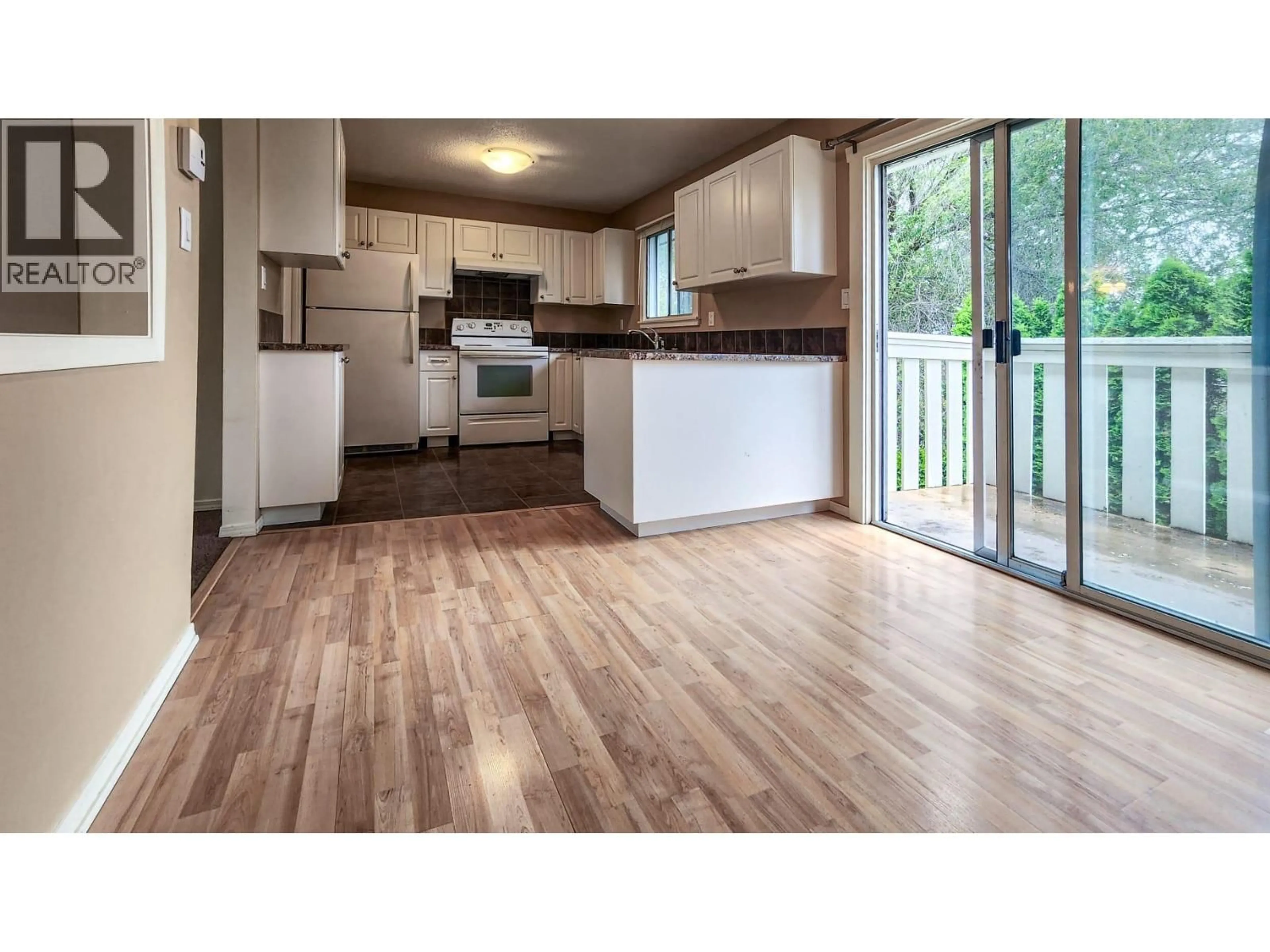 Open concept kitchen, wood/laminate floor for 592 MCCURDY ROAD, Kelowna British Columbia V1X2P5