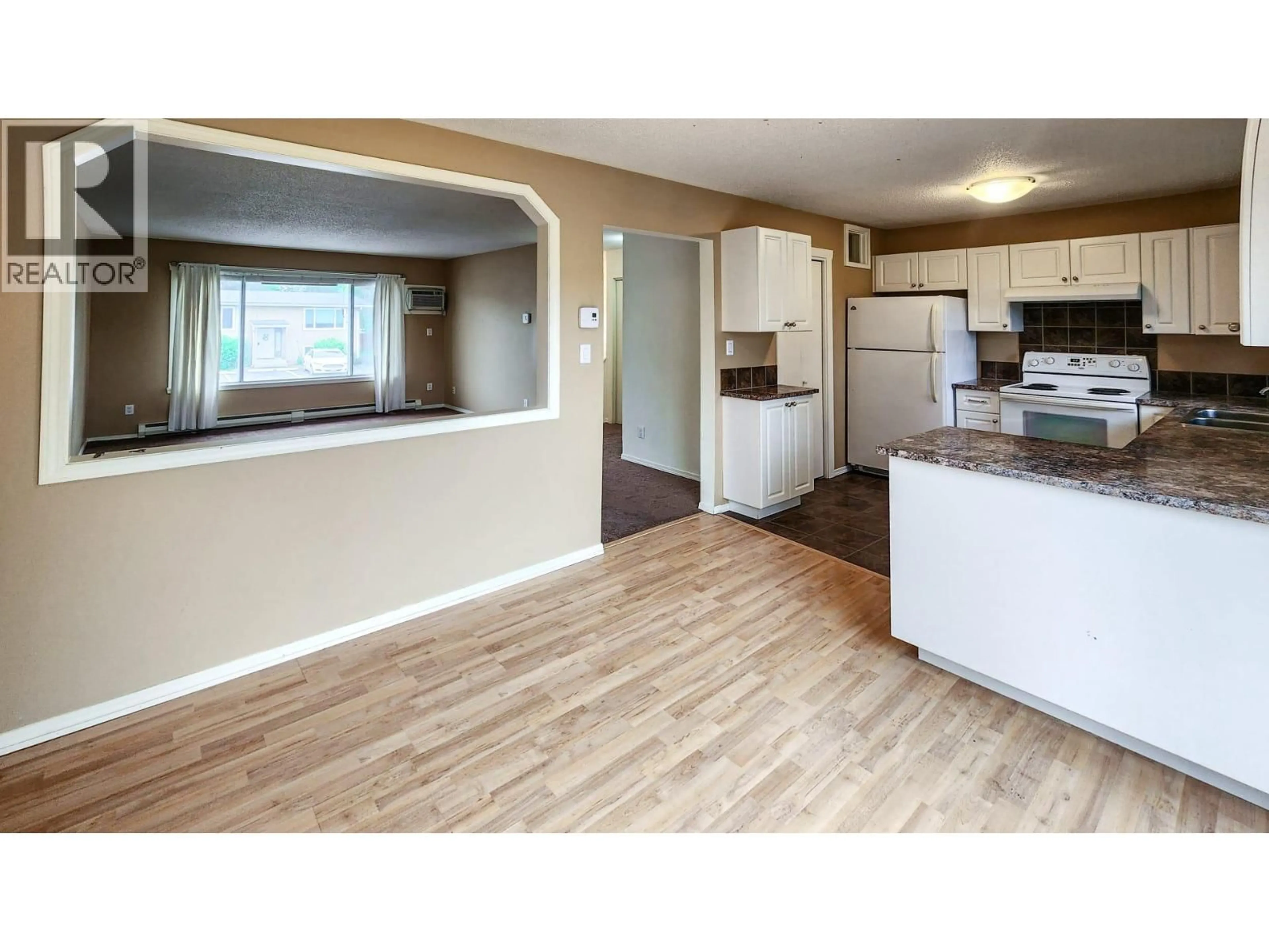 Open concept kitchen, wood/laminate floor for 592 MCCURDY ROAD, Kelowna British Columbia V1X2P5