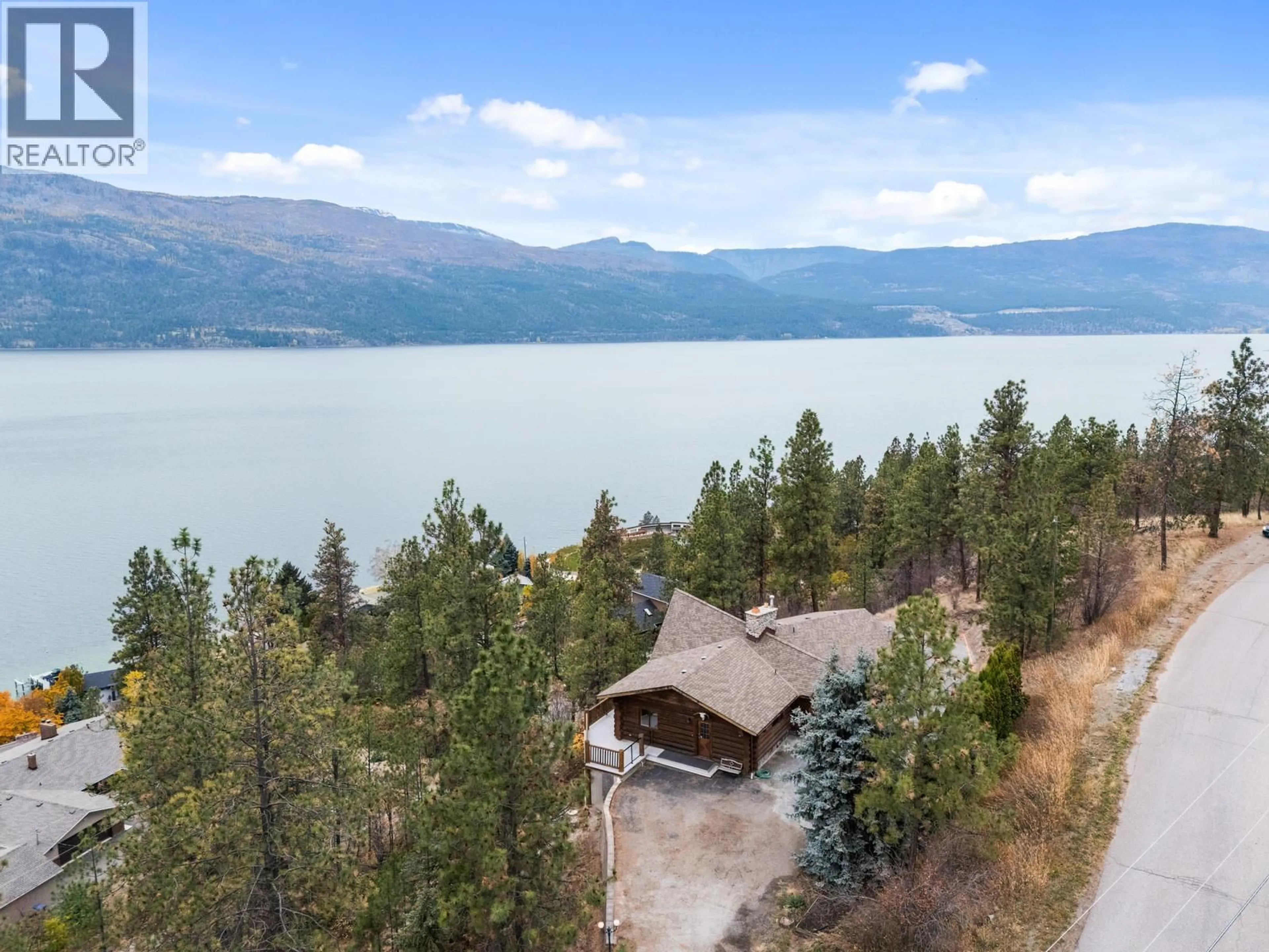 A pic from outside/outdoor area/front of a property/back of a property/a pic from drone, water/lake/river/ocean view for 13574 MOBERLY ROAD, Lake Country British Columbia V4V1A2
