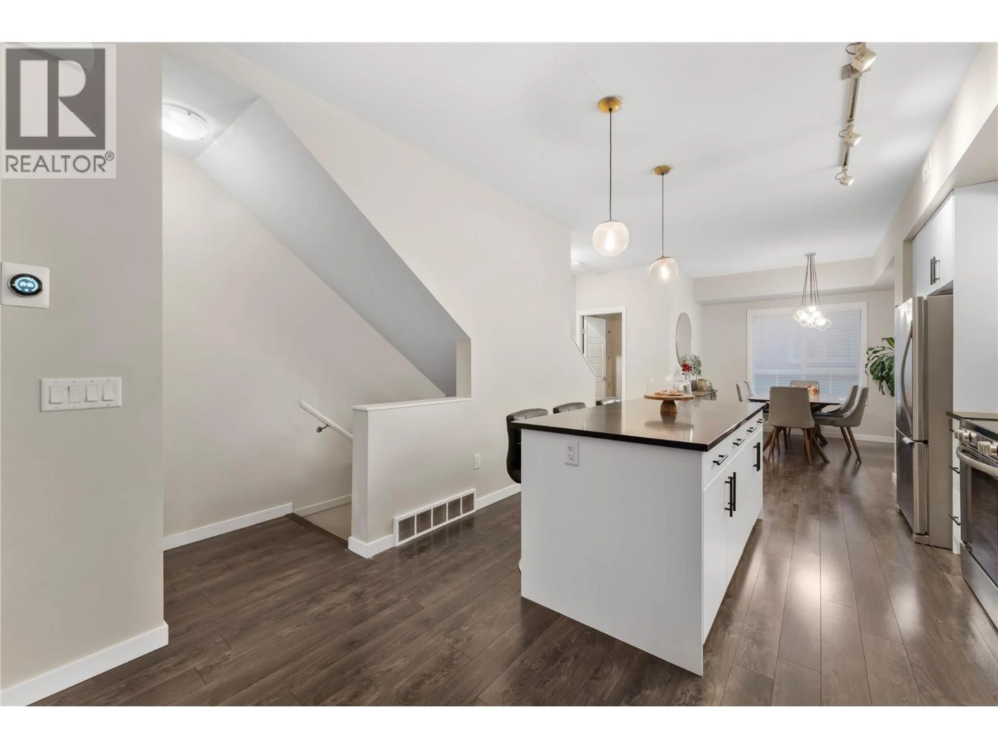 Open concept kitchen, wood/laminate floor for 69 - 680 OLD MEADOWS ROAD, Kelowna British Columbia V1W5L4