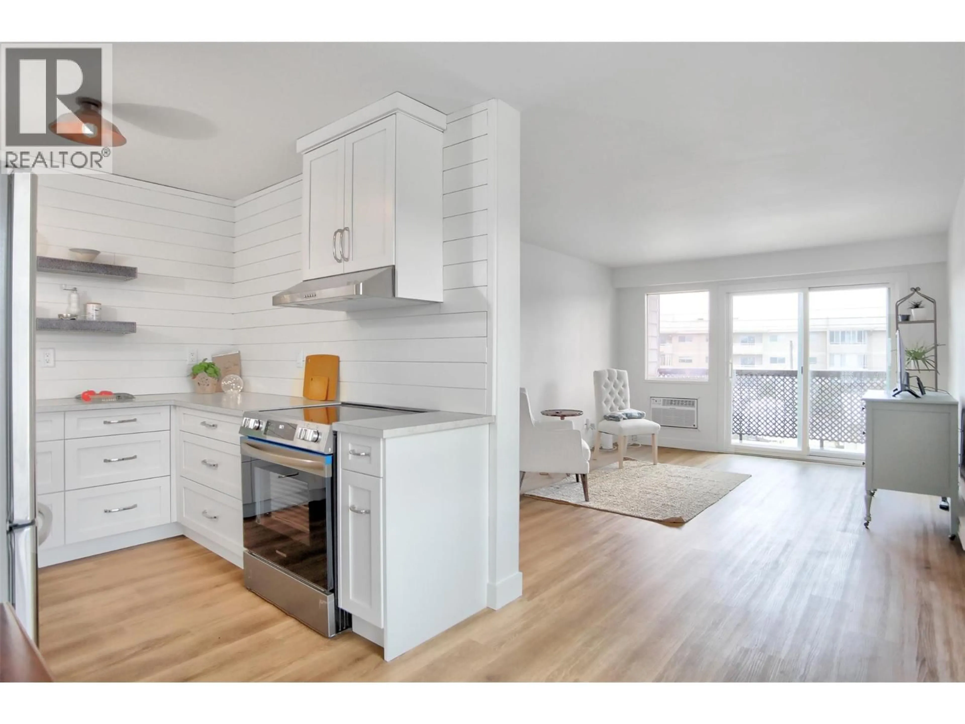 Open concept kitchen, wood/laminate floor for 202 - 95 WINNIPEG STREET, Penticton British Columbia V2A5L9