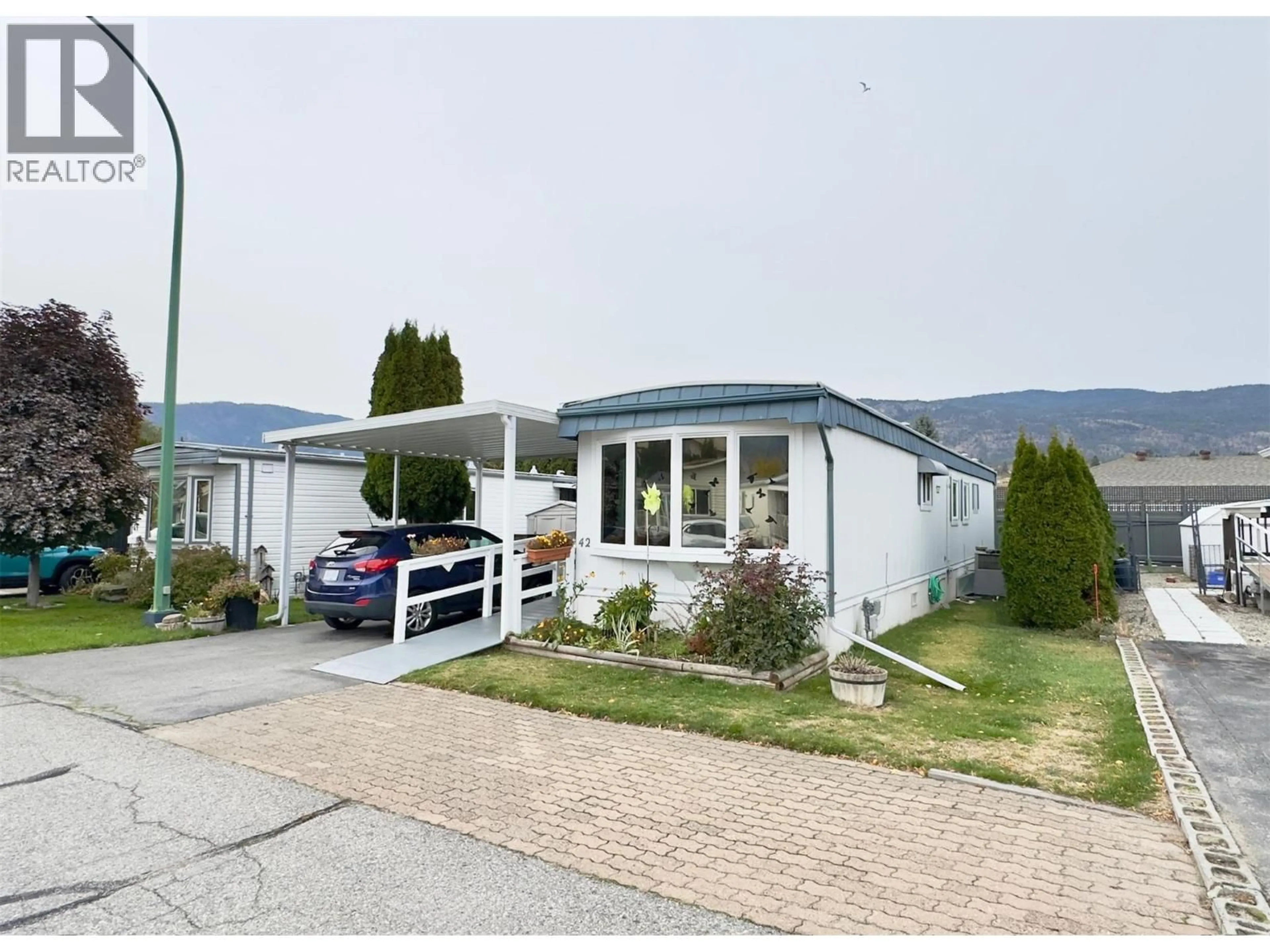 Home with vinyl exterior material, mountain view for 42 - 999 BURNABY AVENUE, Penticton British Columbia V2A1G7
