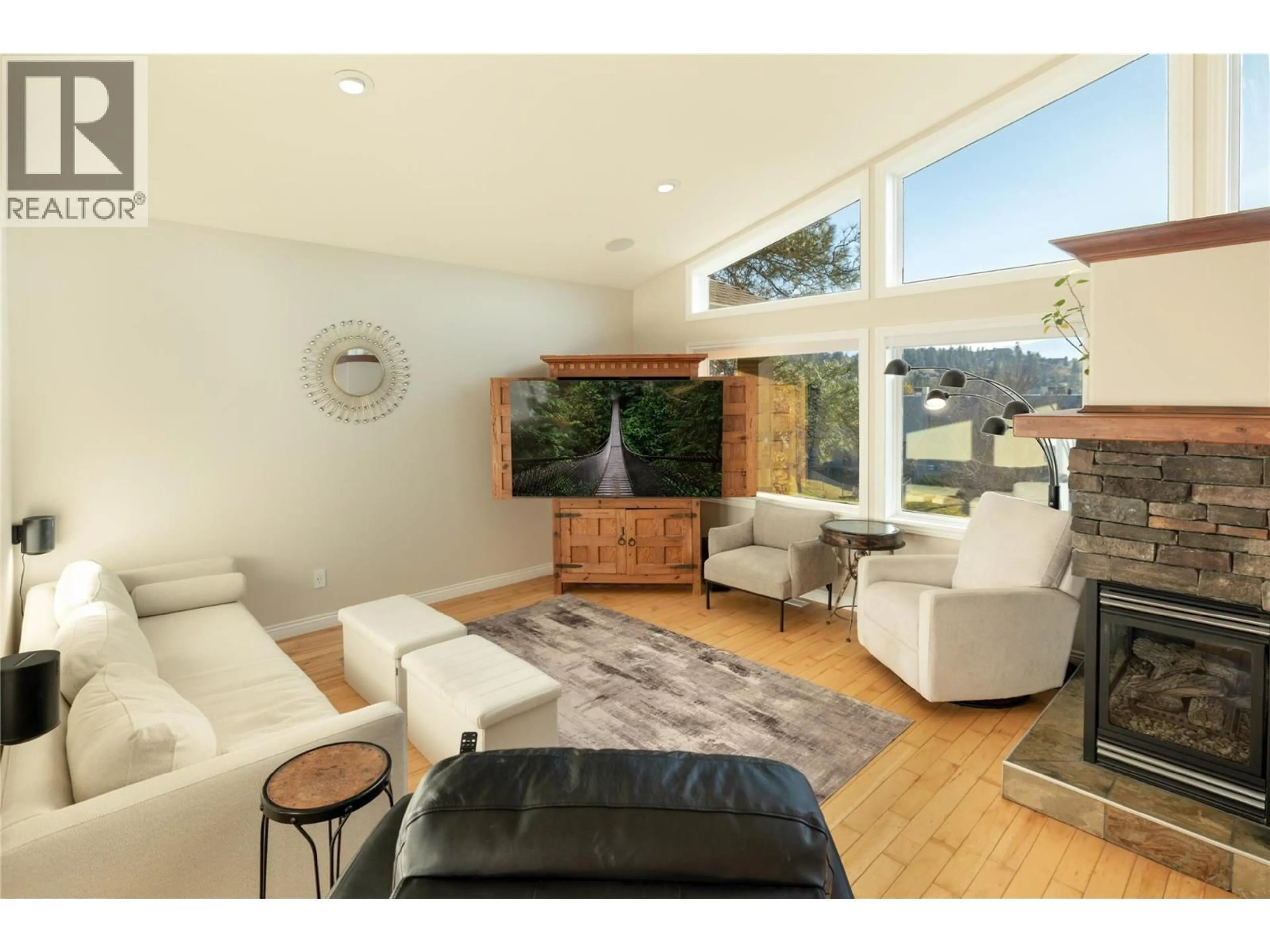 Living room with furniture, wood/laminate floor for 3356 MERLOT COURT, West Kelowna British Columbia V4T2W7