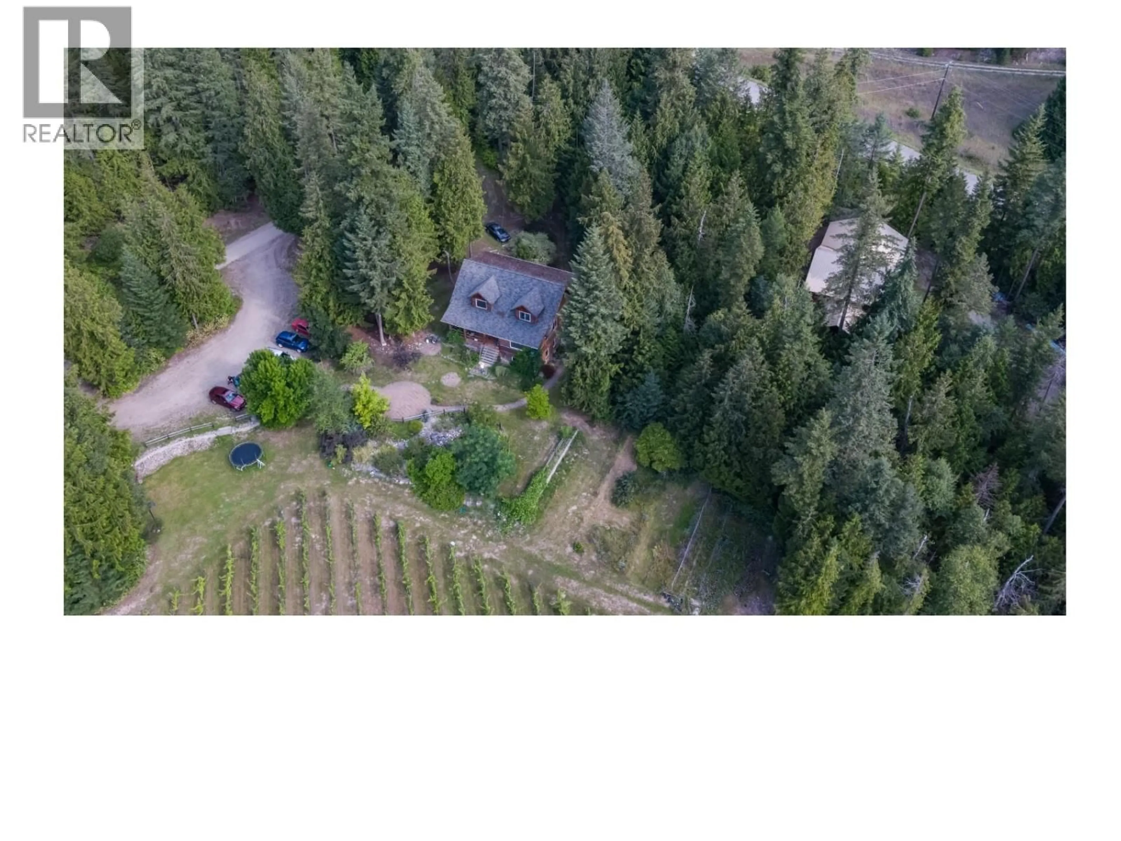 A pic from outside/outdoor area/front of a property/back of a property/a pic from drone, forest/trees view for 2302 SKIMIKIN ROAD, Tappen British Columbia V0E2X0