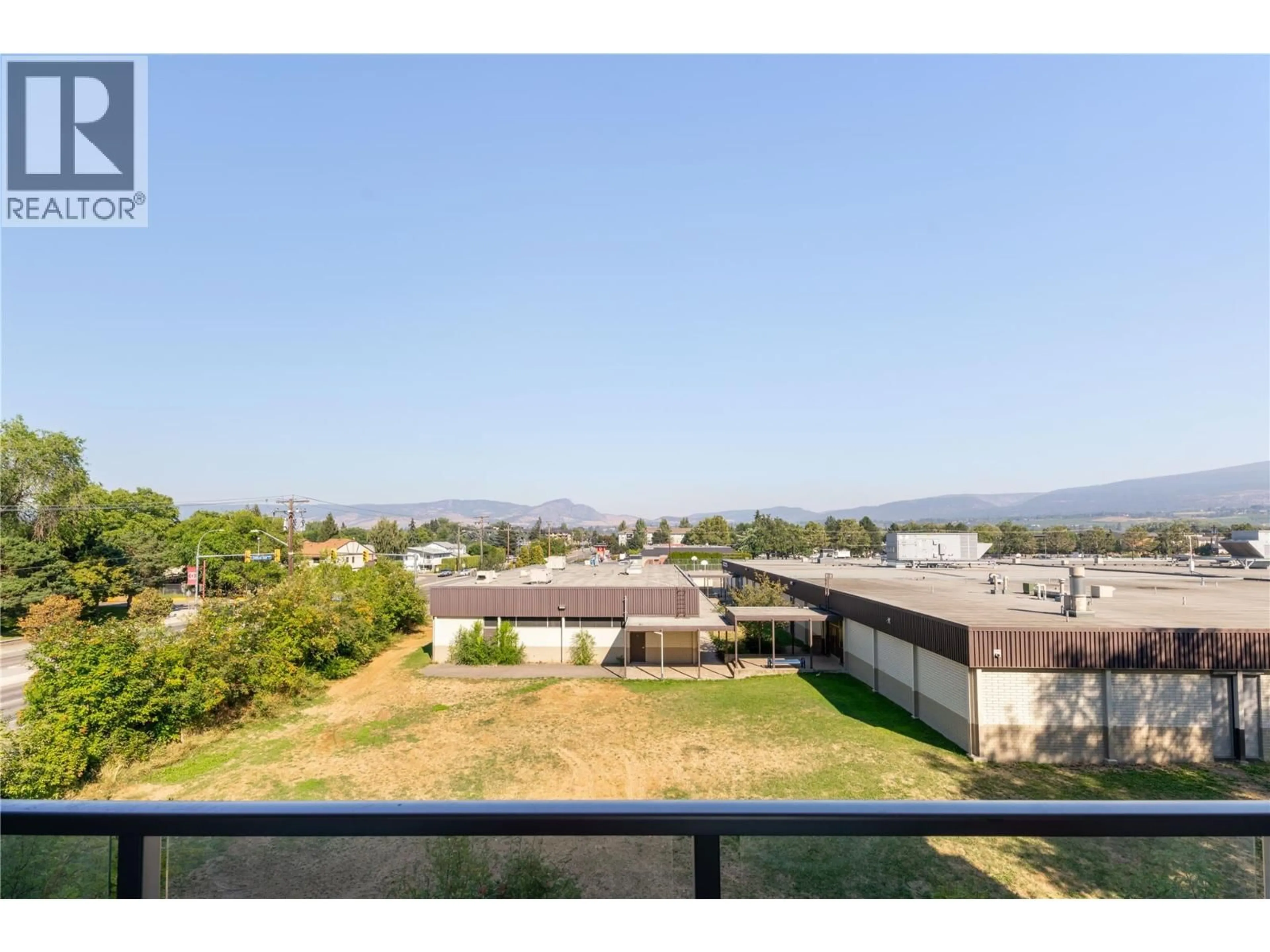 A pic from outside/outdoor area/front of a property/back of a property/a pic from drone, mountain view for 309 - 1083 KLO ROAD, Kelowna British Columbia V1Y4X6