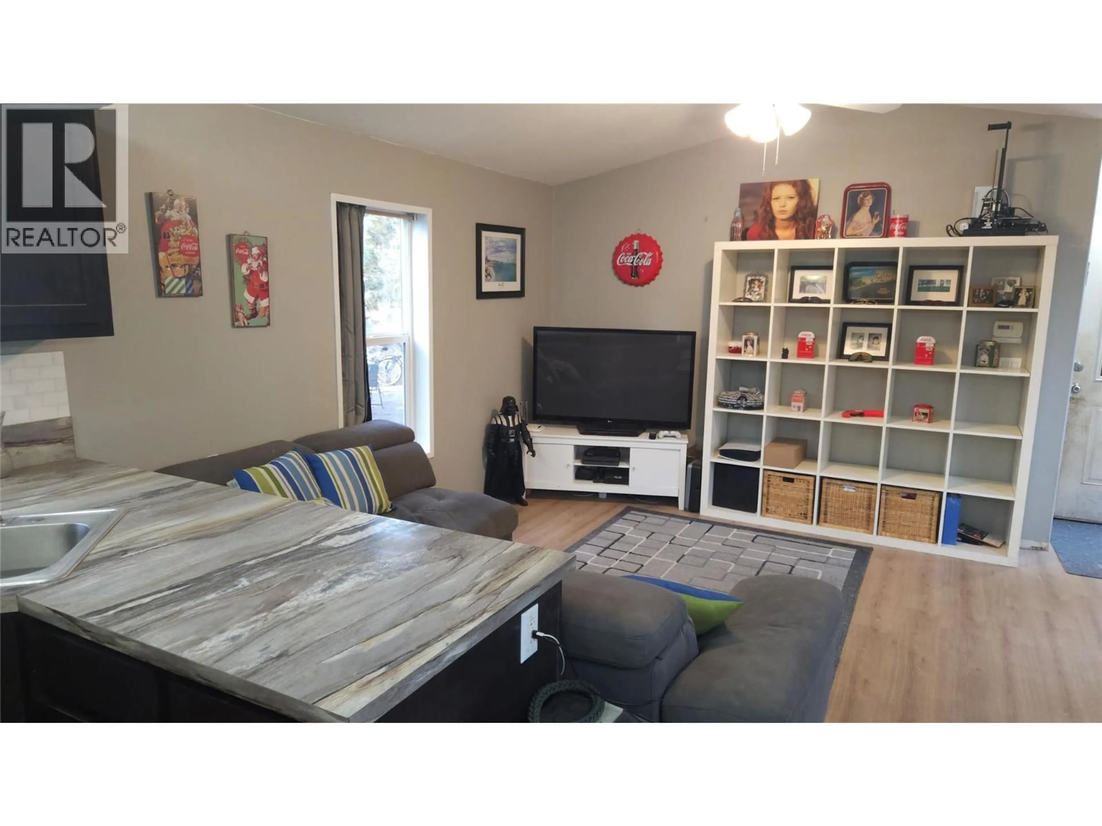 Living room with furniture, wood/laminate floor for 7745 5A HIGHWAY, Kamloops British Columbia V0E2A0