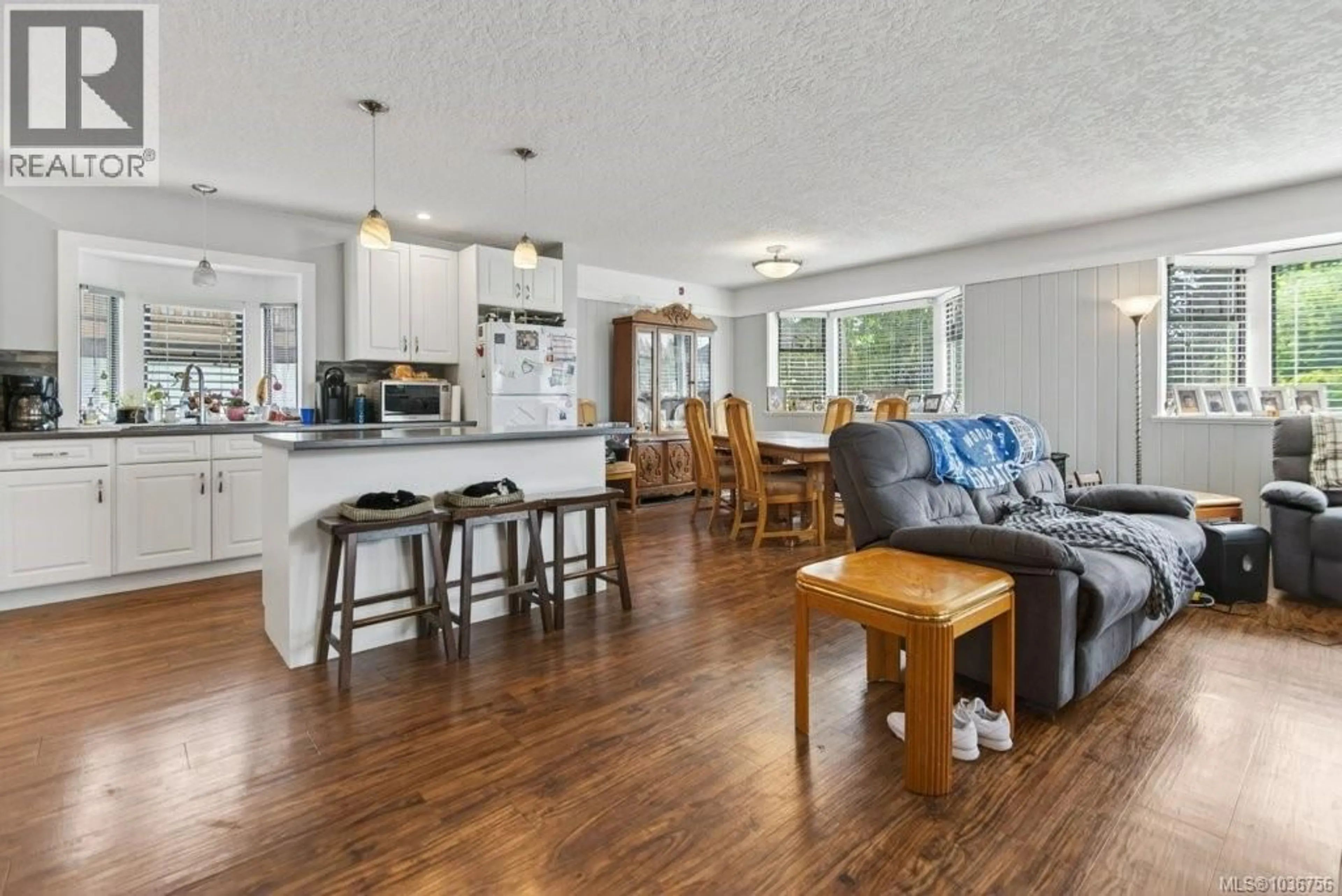 Open concept kitchen, wood/laminate floor for 1005 26TH STREET, Courtenay British Columbia V9N7H6