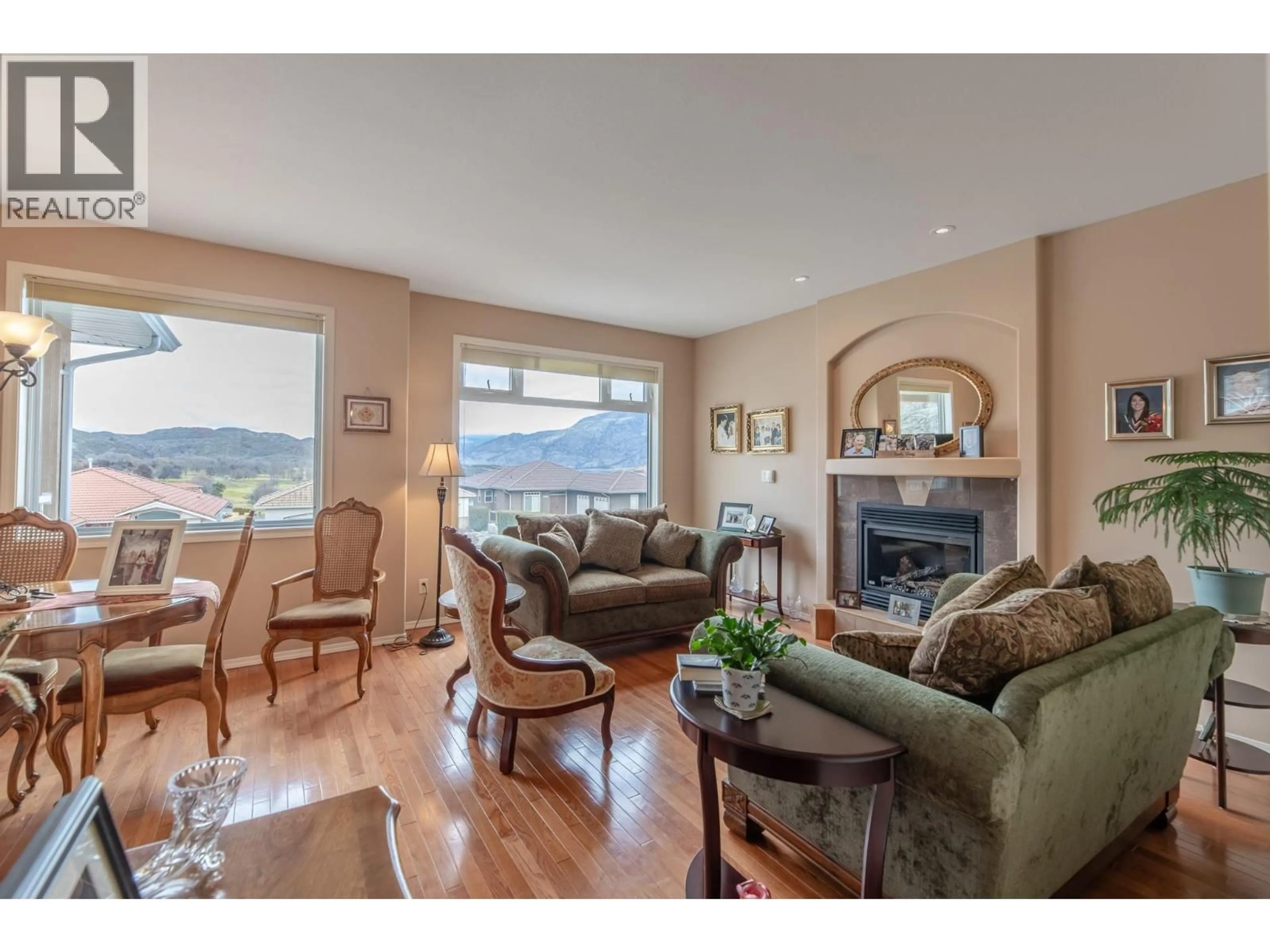 Living room with furniture, wood/laminate floor for 11908 LA COSTA LANE, Osoyoos British Columbia V0H1V4