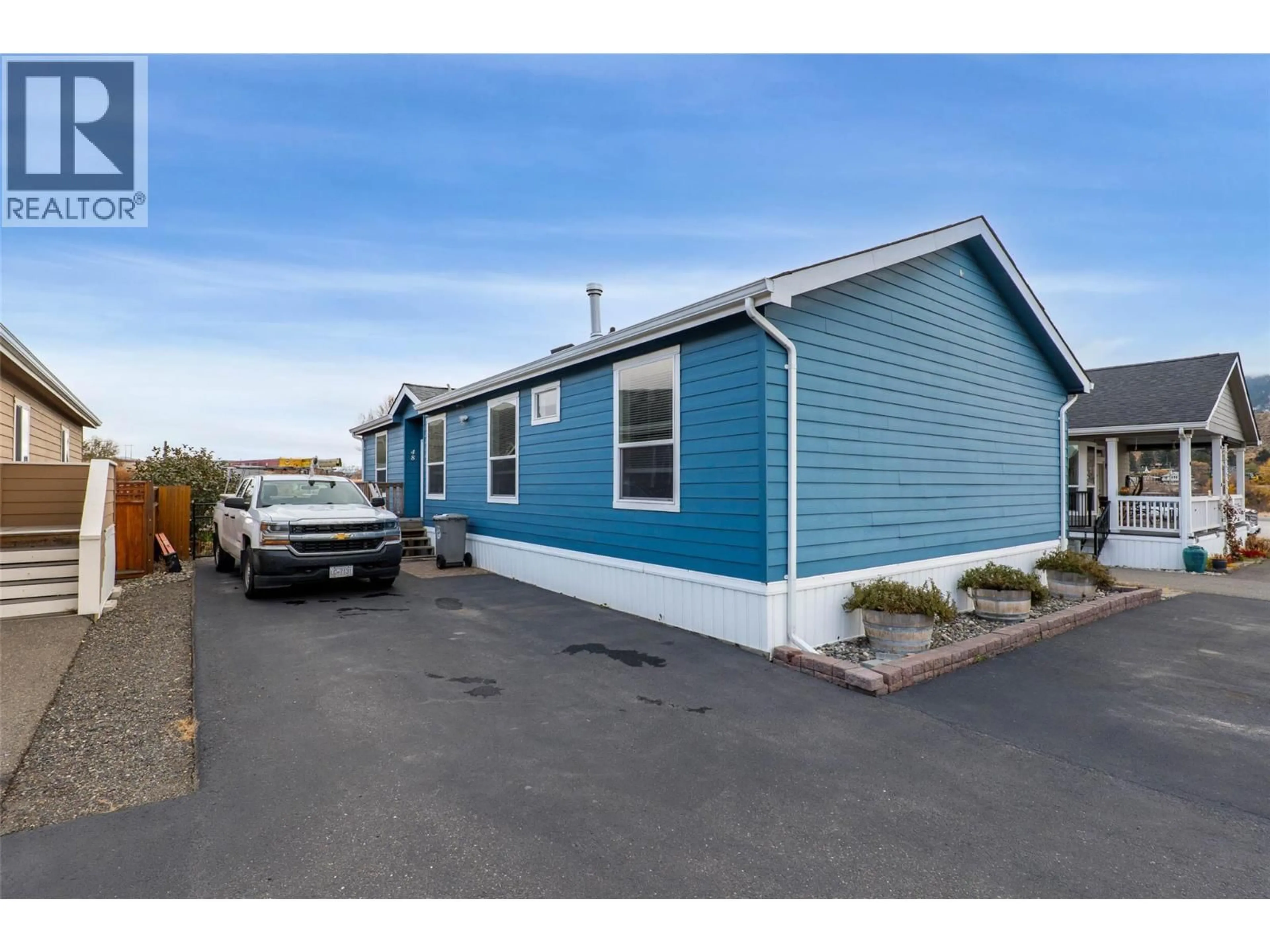 Home with vinyl exterior material, street for 48 - 712 SHUSWAP E ROAD, Kamloops British Columbia V2H0C8