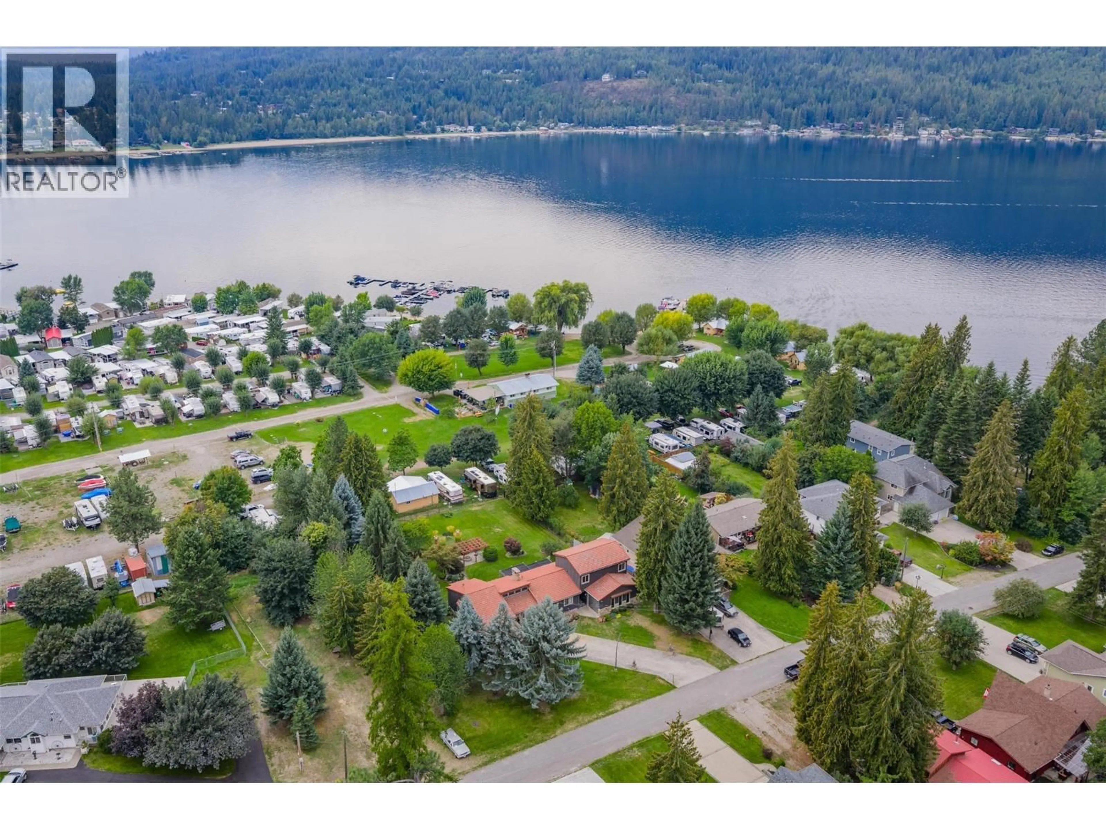 A pic from outside/outdoor area/front of a property/back of a property/a pic from drone, water/lake/river/ocean view for 25 WILSON ROAD, Christina Lake British Columbia V0H1E0