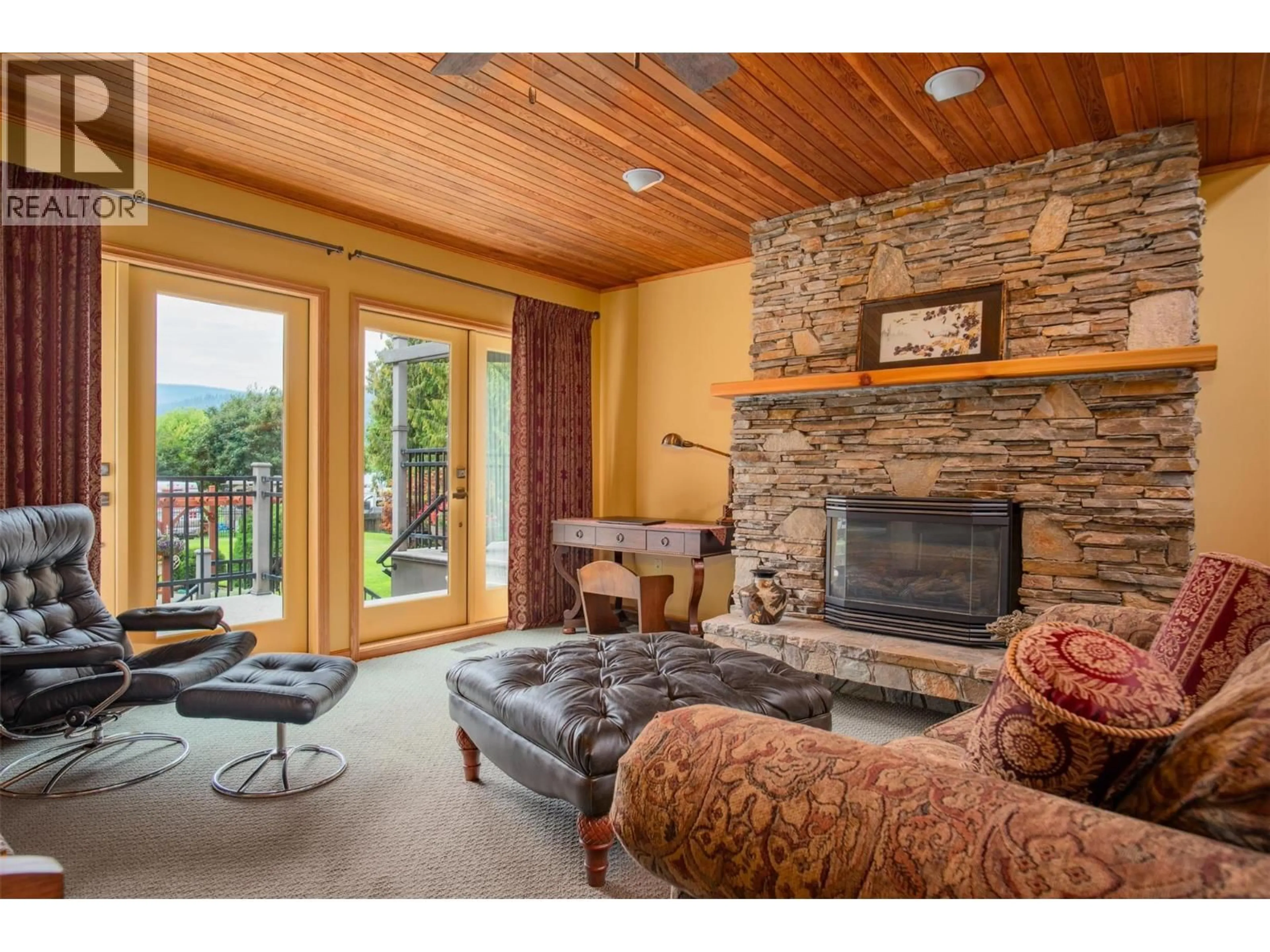 Living room with furniture, unknown for 25 WILSON ROAD, Christina Lake British Columbia V0H1E0