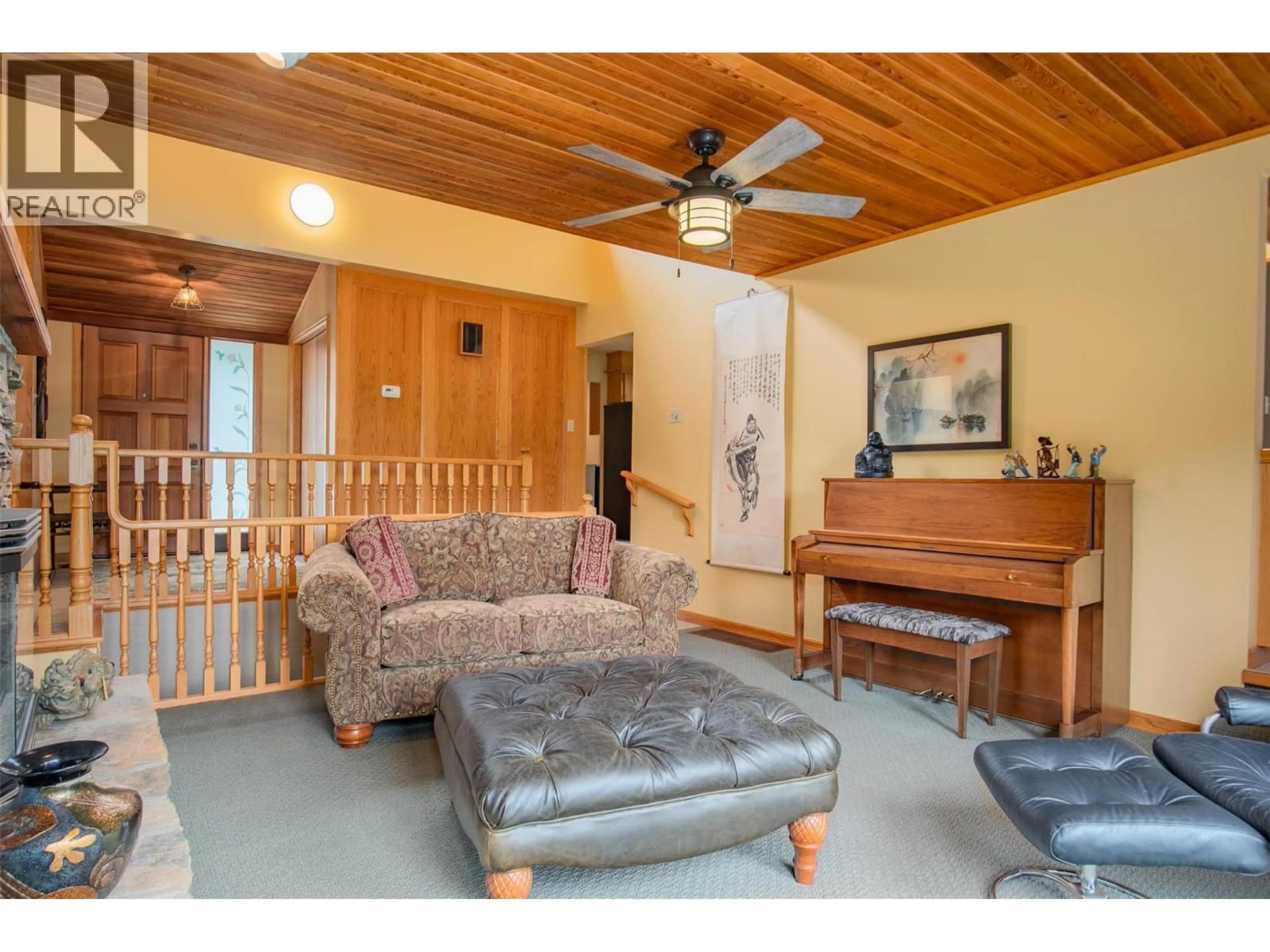 Living room with furniture, wood/laminate floor for 25 WILSON ROAD, Christina Lake British Columbia V0H1E0