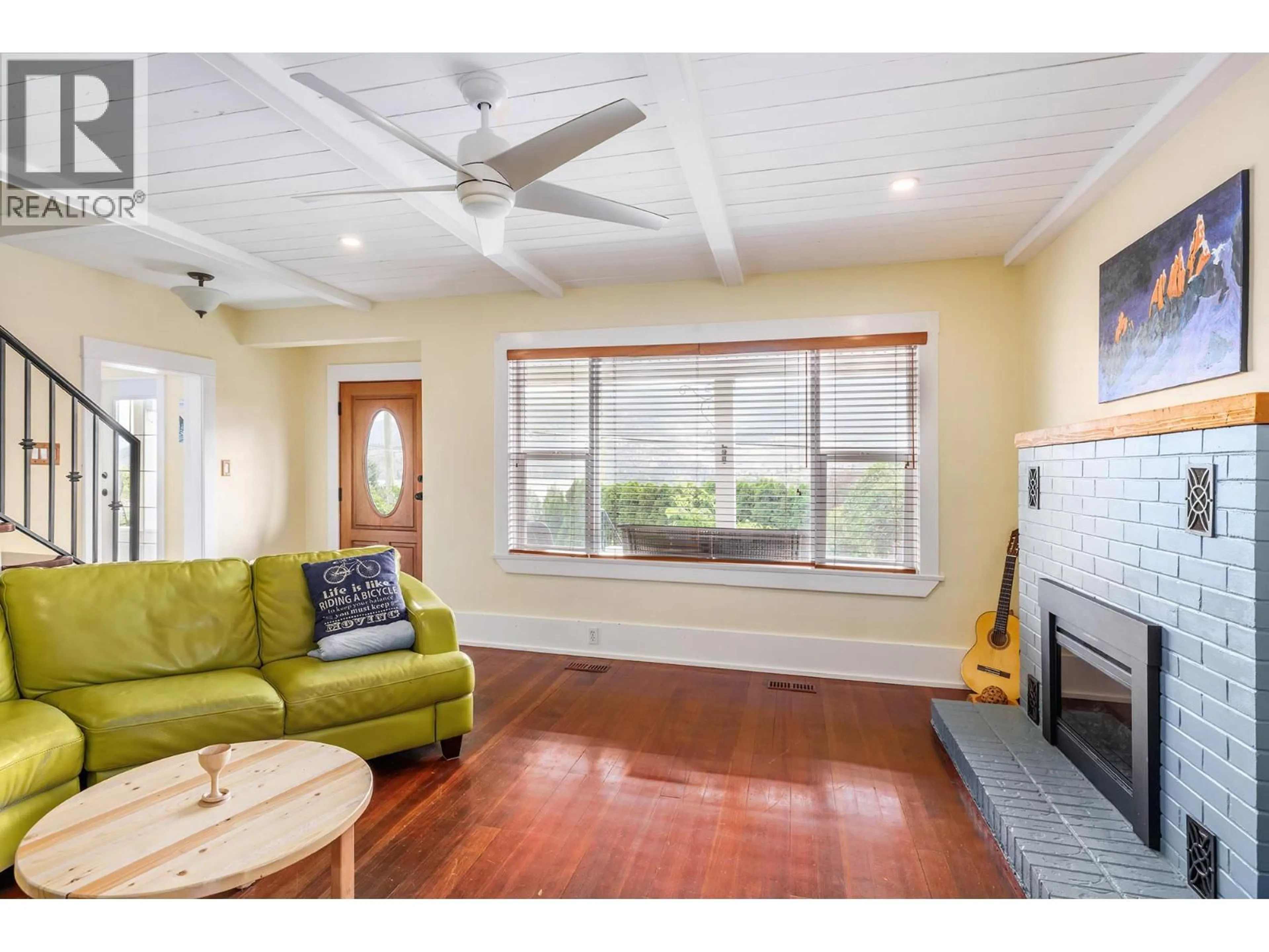 Living room with furniture, wood/laminate floor for 15818 OLD MISSION ROAD, Lake Country British Columbia V4V2G8