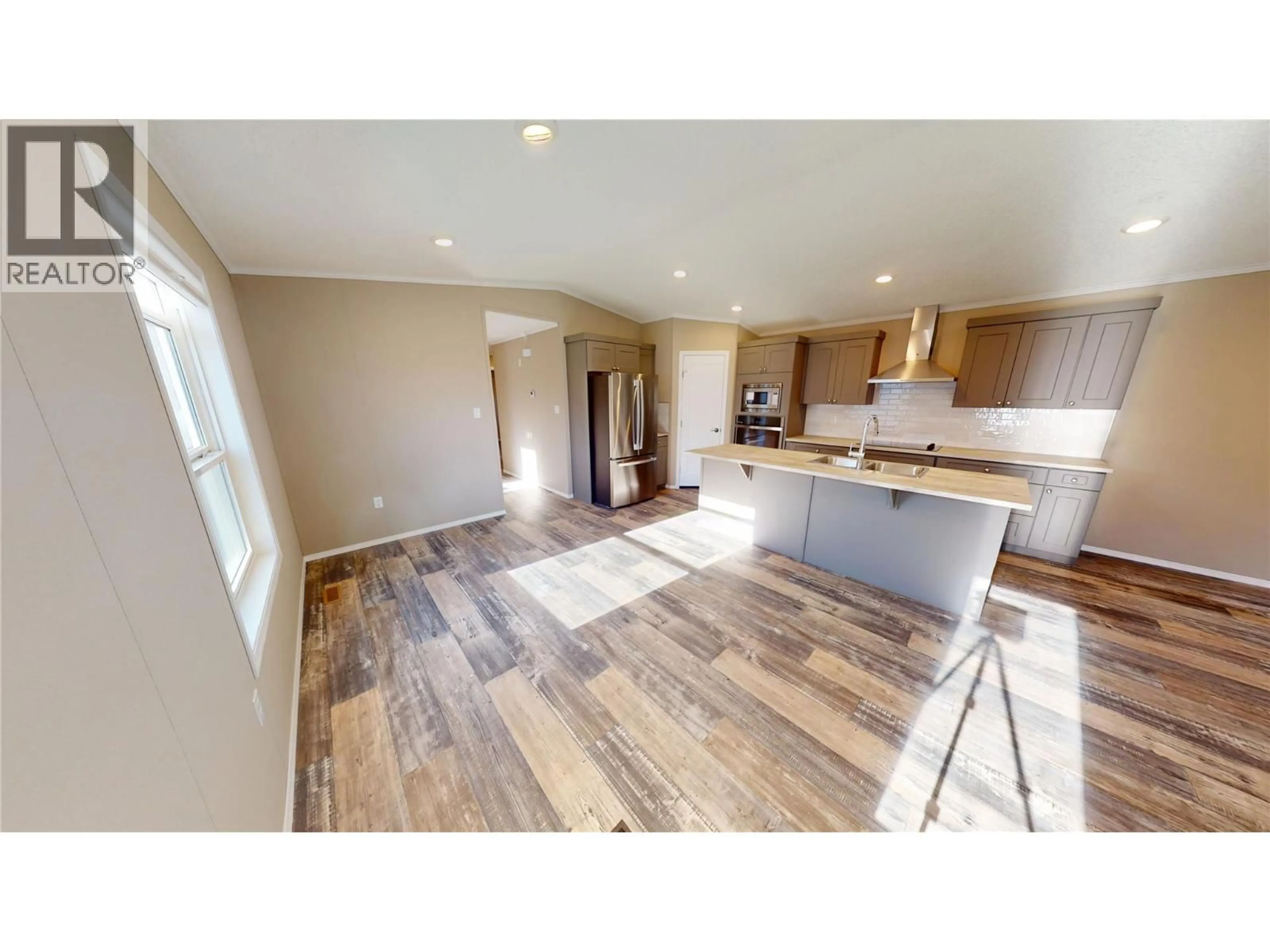 Open concept kitchen, wood/laminate floor for #78 - 100 INDUSTRIAL 1 ROAD, Sparwood British Columbia V0B2G1