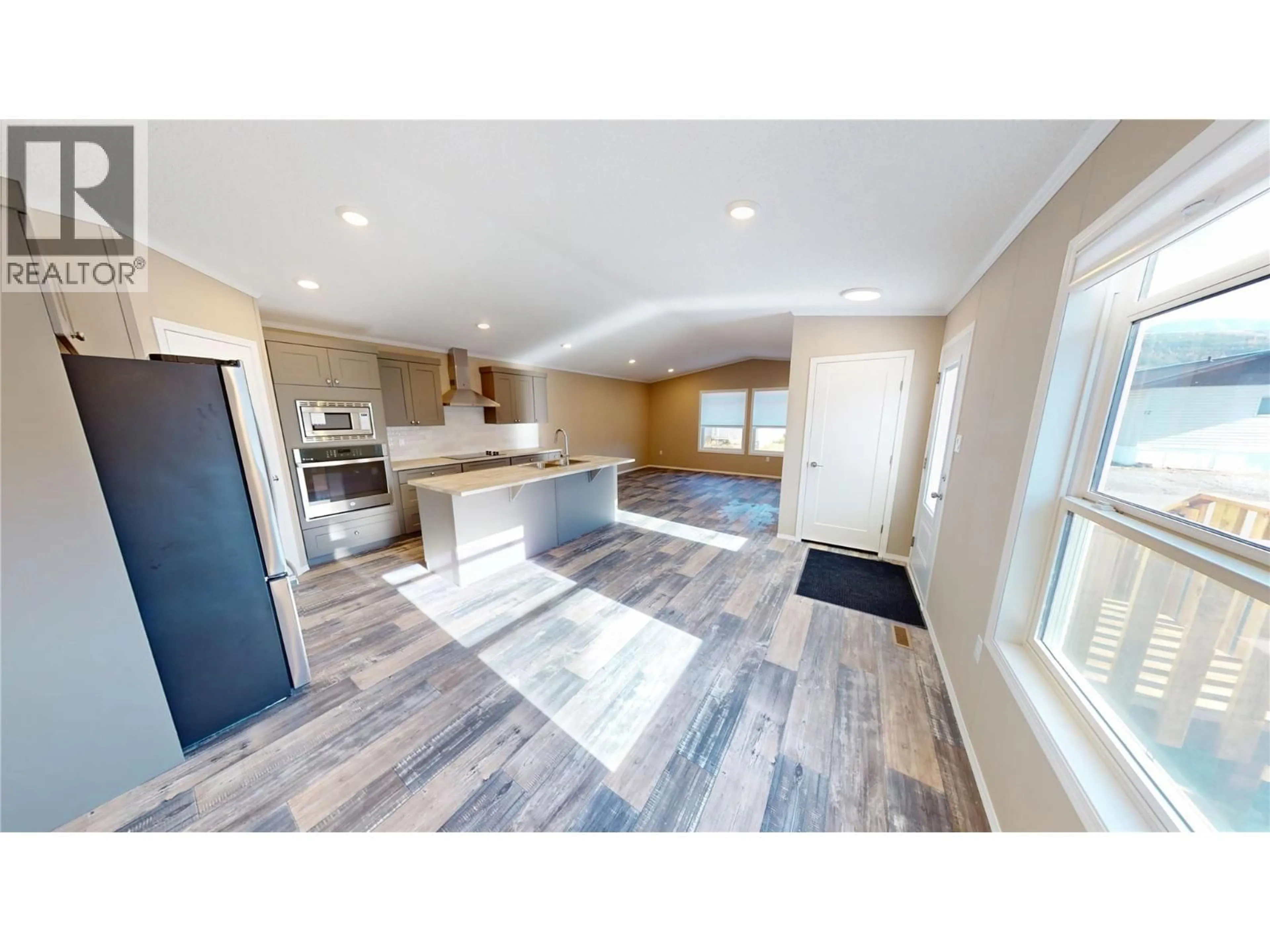 Open concept kitchen, wood/laminate floor for #78 - 100 INDUSTRIAL 1 ROAD, Sparwood British Columbia V0B2G1