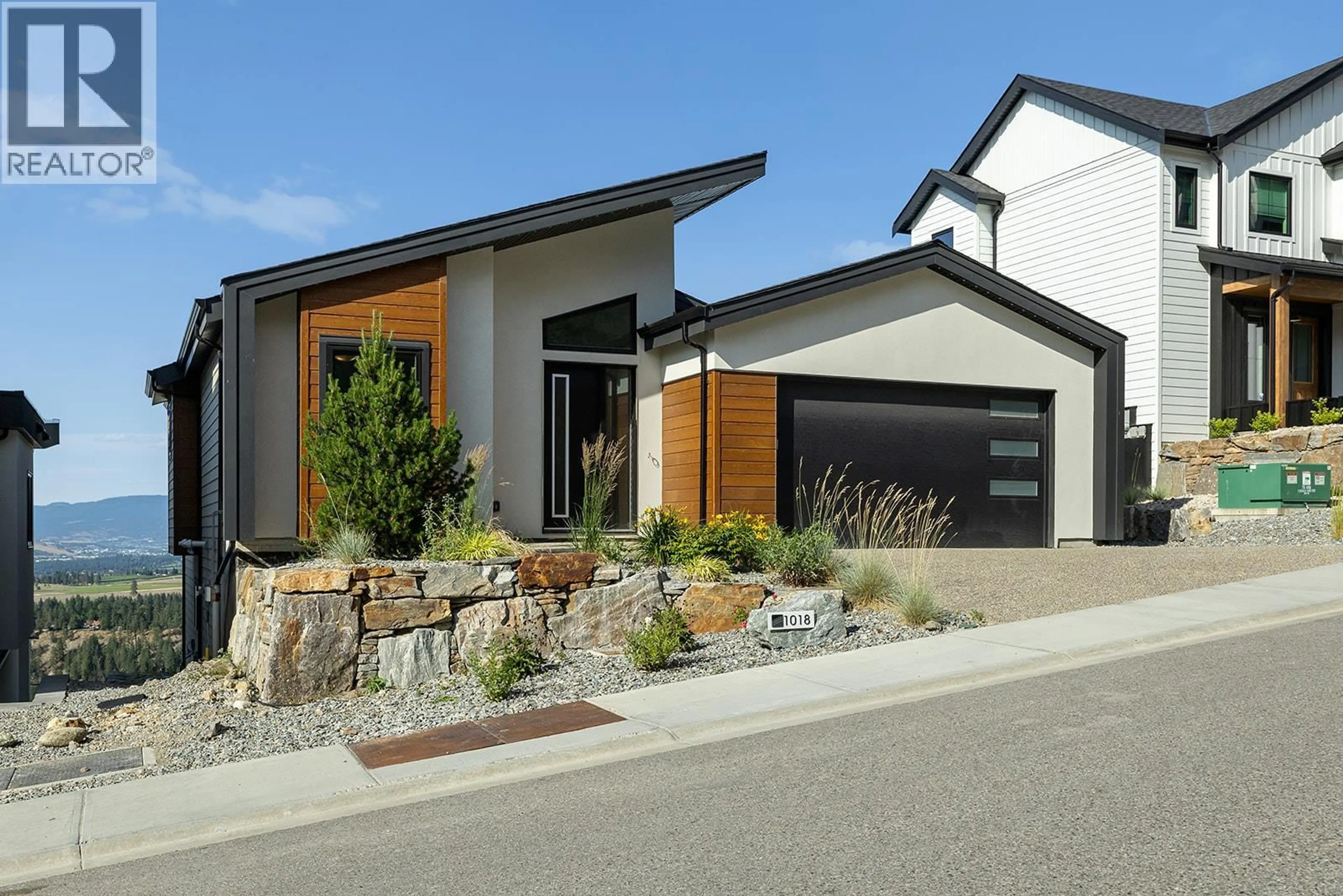 Home with brick exterior material, street for 1018 EMSLIE STREET, Kelowna British Columbia V1W5J1