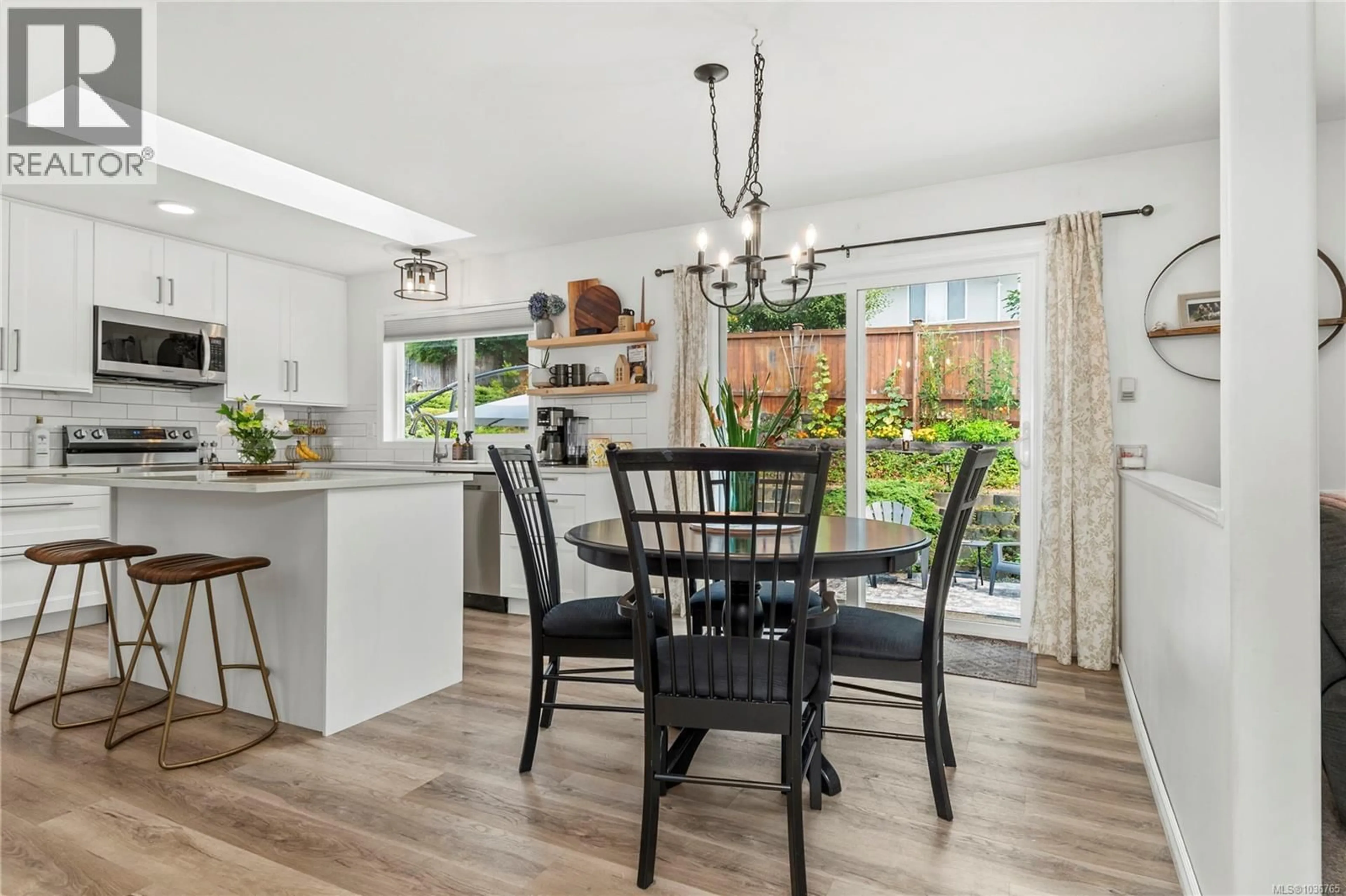 Open concept kitchen, wood/laminate floor for 1860 BRANT PLACE, Courtenay British Columbia V9N8Y8