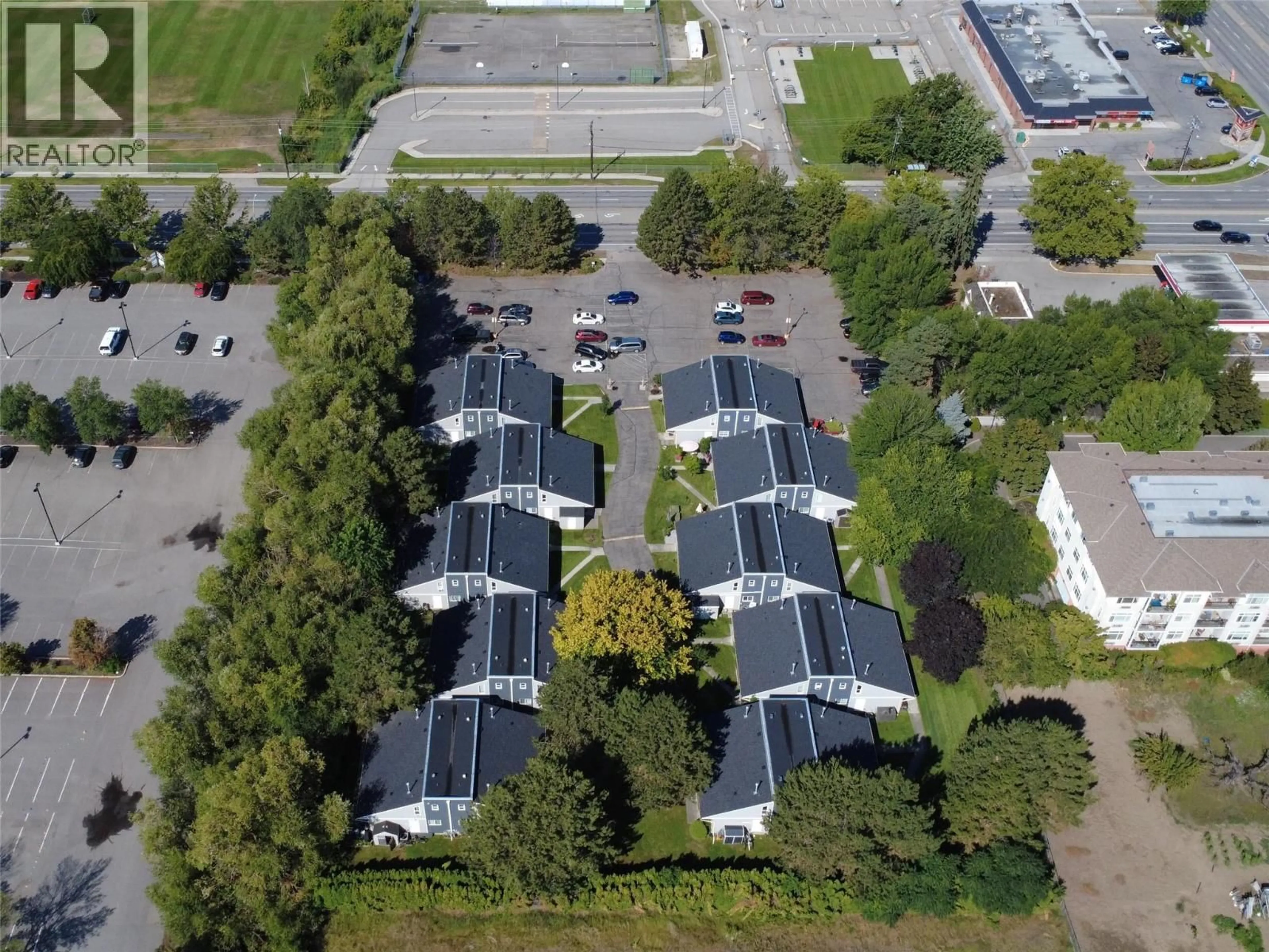 A pic from outside/outdoor area/front of a property/back of a property/a pic from drone, street for 304 - 3155 GORDON DRIVE, Kelowna British Columbia V1W3N6