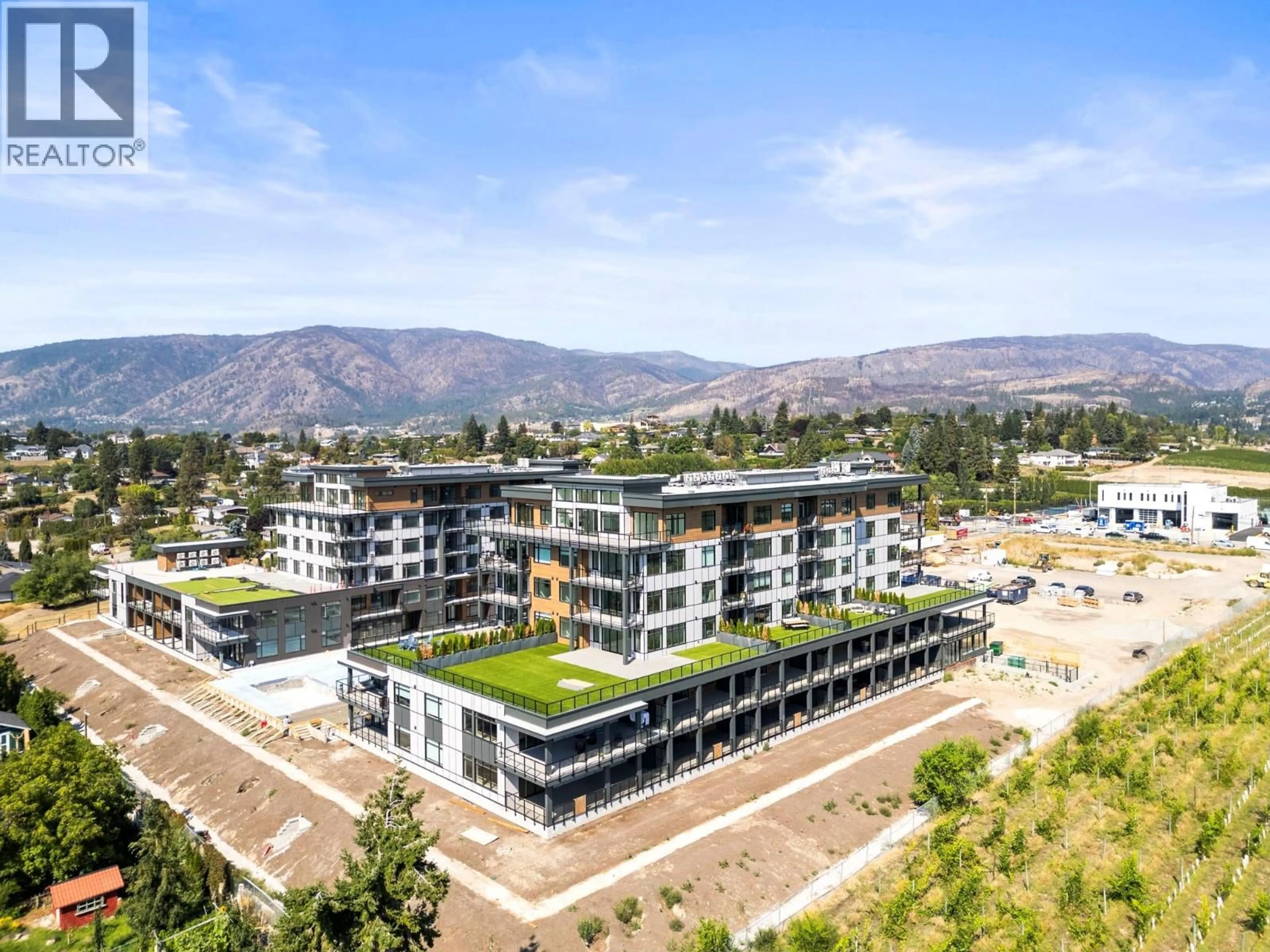 A pic from outside/outdoor area/front of a property/back of a property/a pic from drone, mountain view for 207 - 2760 OLALLA ROAD, West Kelowna British Columbia V1Z2A9