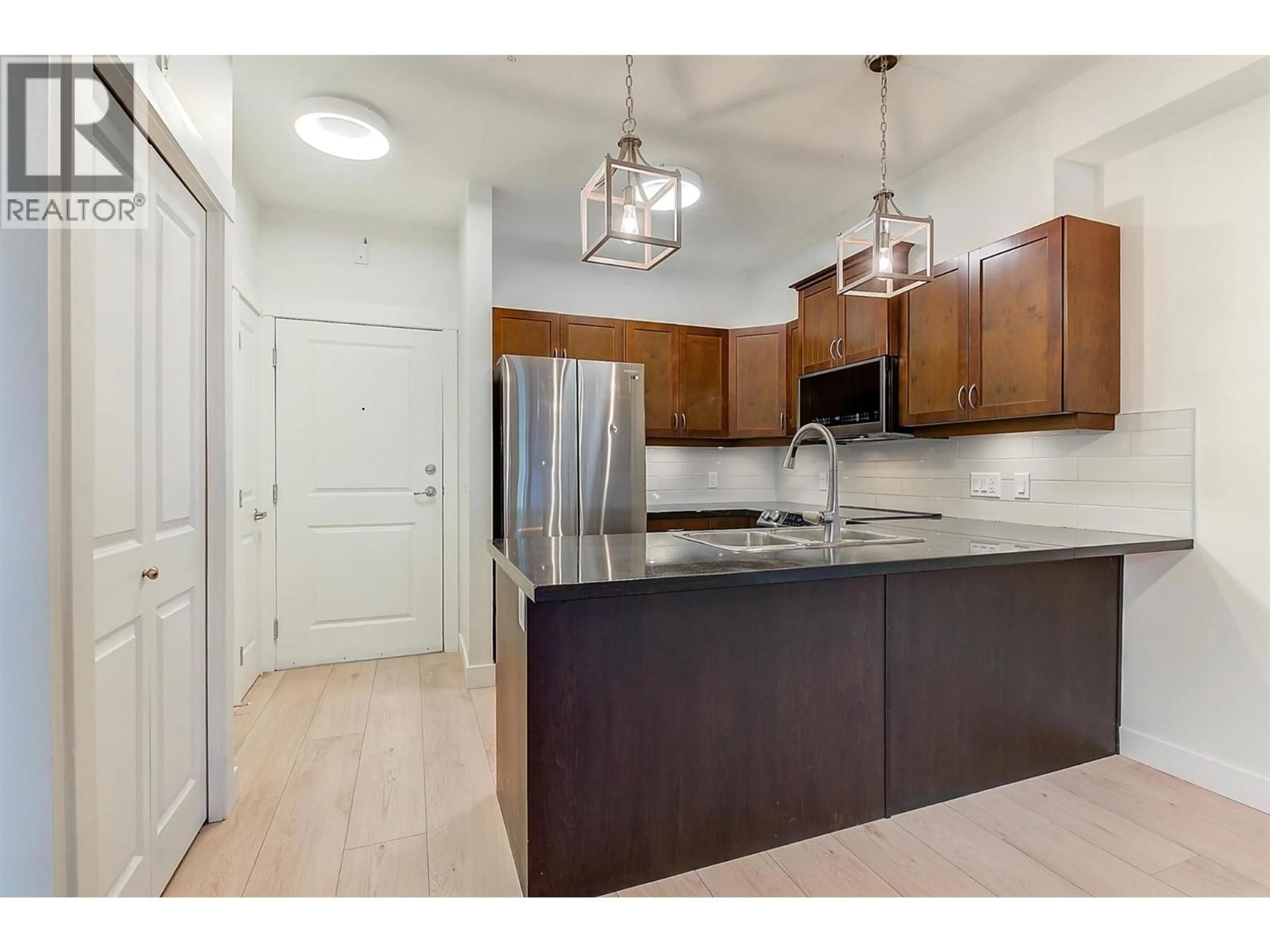 Open concept kitchen, unknown for 102 - 3533 CARRINGTON ROAD, West Kelowna British Columbia V4T2Z9